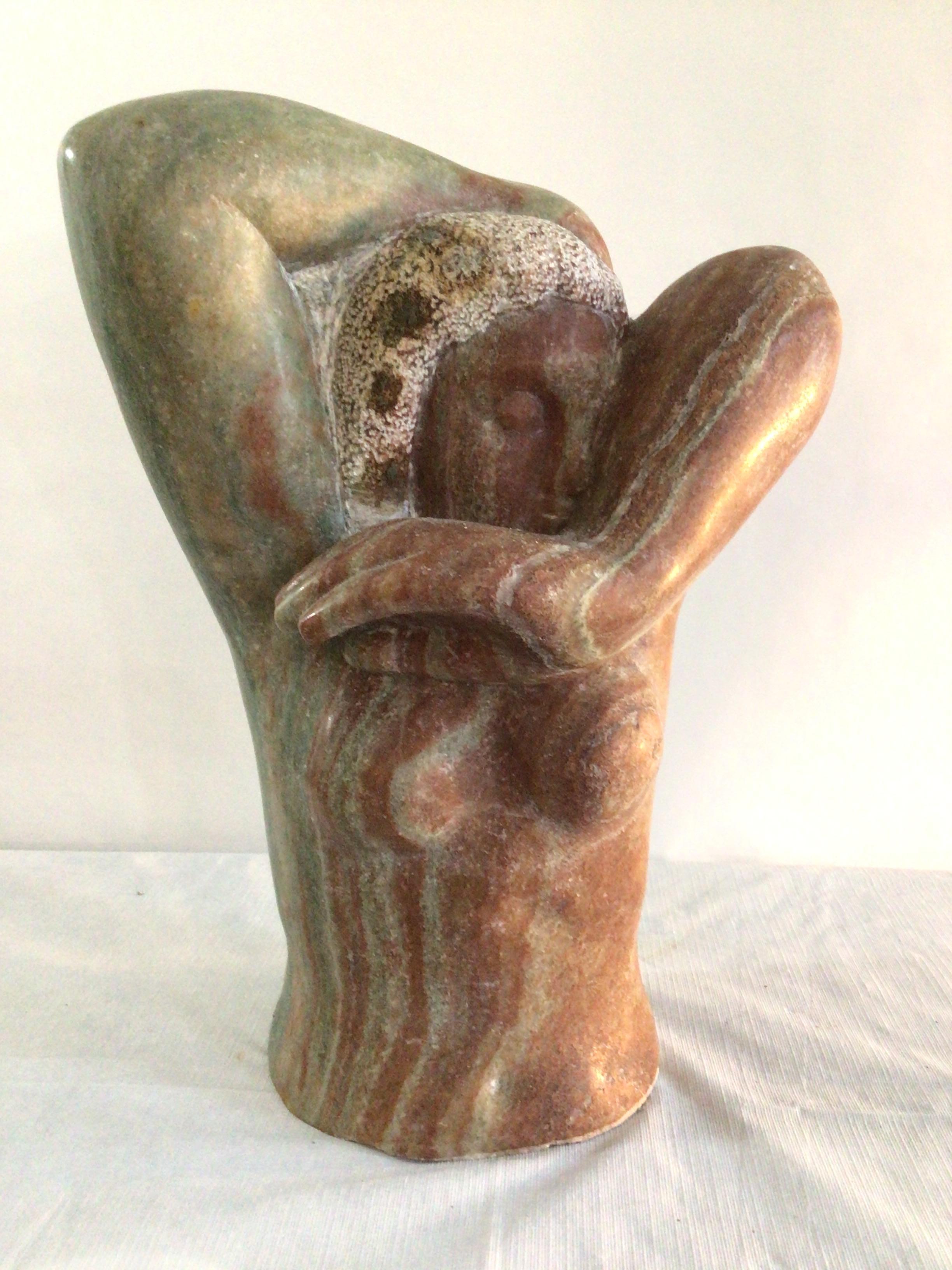 1960s Marble Sculpture Of A Woman With Oversized Hands and textured hair
Polished and Raw Stone Surfaces
Colors: Red, Green.
