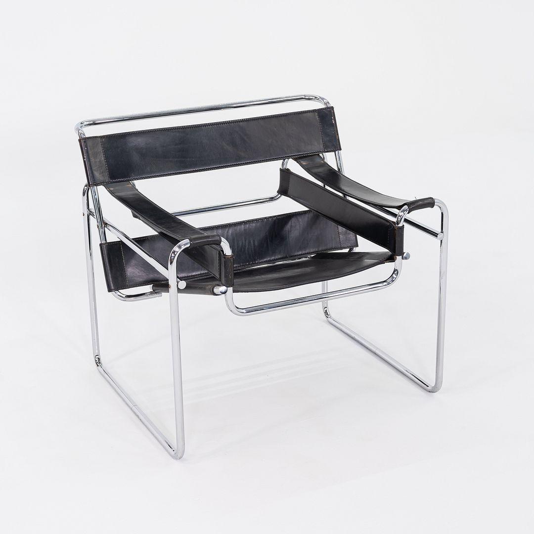 This is a Wassily B3 Lounge Chair, originally designed by Marcel Breuer in 1925. This particular example was produced by Gavina in Italy in the 1960s and imported and distributed by Knoll. The chair has black leather upholstery and a chromed-steel