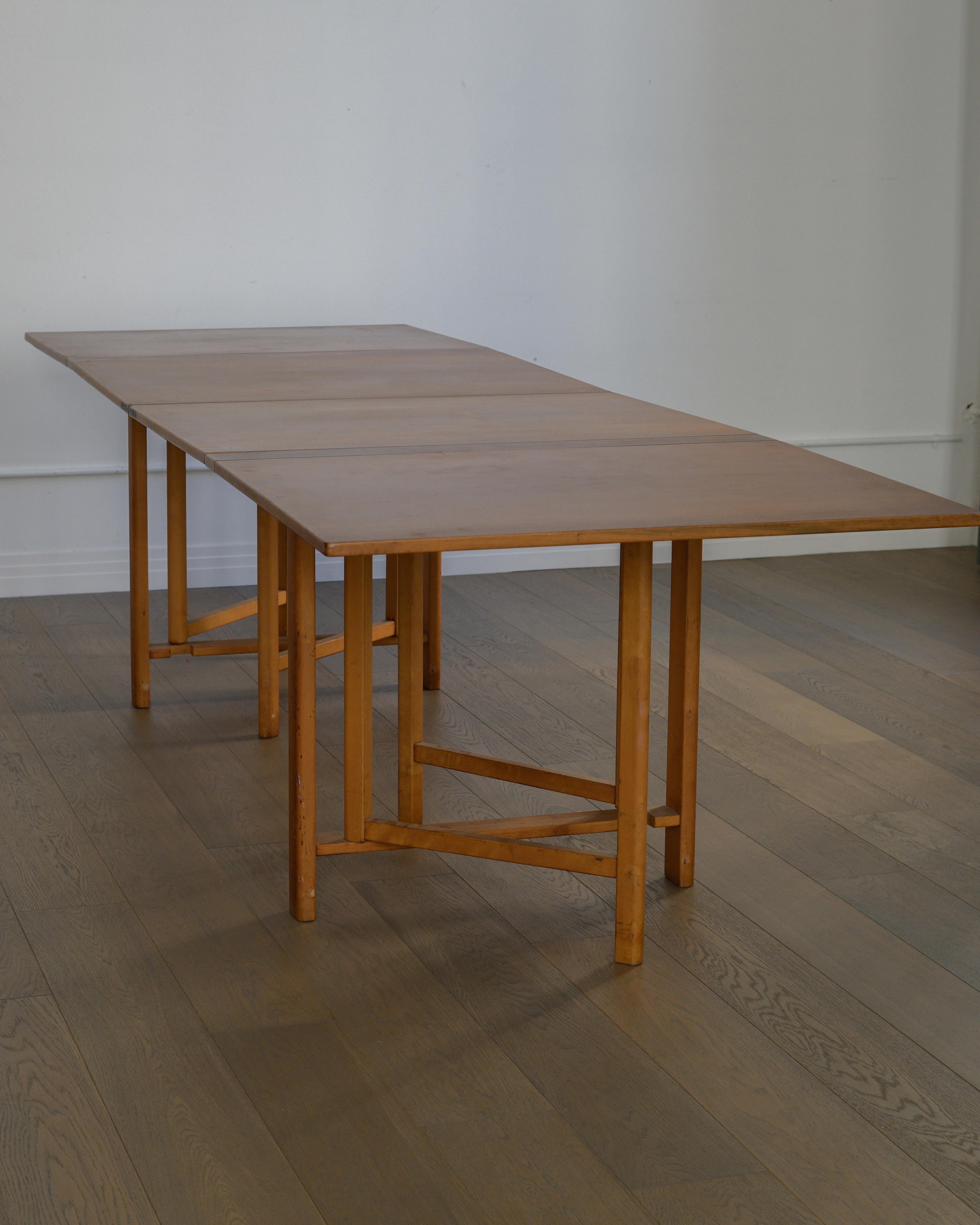 1960 Bruno Mathsson Maria folding table by Firma Karl Mathsson, Sweden. 

Really neat mid century table that expands from easily storable to seating double digits comfortably. Can be used in many variations as needs arise. 

In good vintage