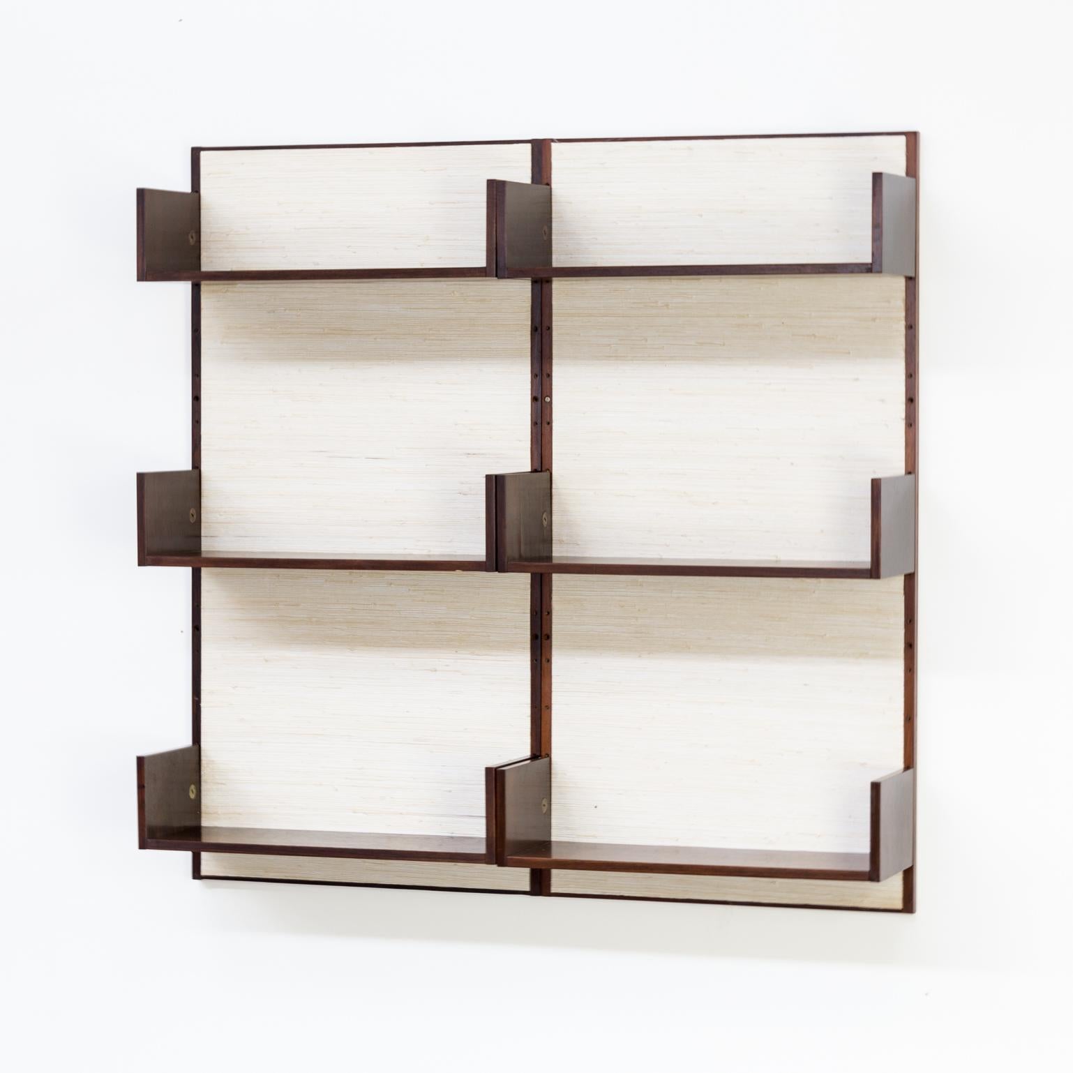 1960s Marten Franckema rosewood and seagrass canvas wall unit 6 shelves for Fristho. Good condition consistent with age and use.