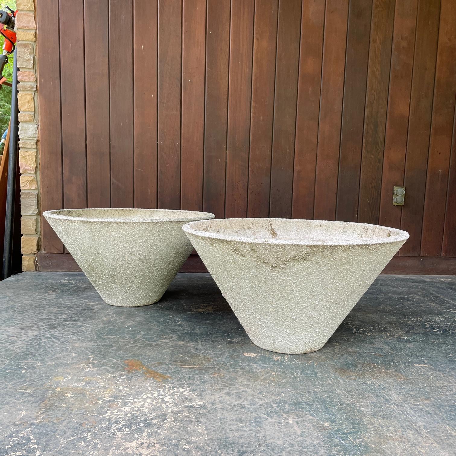 These are quite massive and beautiful pair of conical entrance planters.  26 lbs. each. No markings found. Each pot has two drain holes. And each pot has a semi flaky textural painted surface on the cement, not sure if this is original.  

Dia 30 x