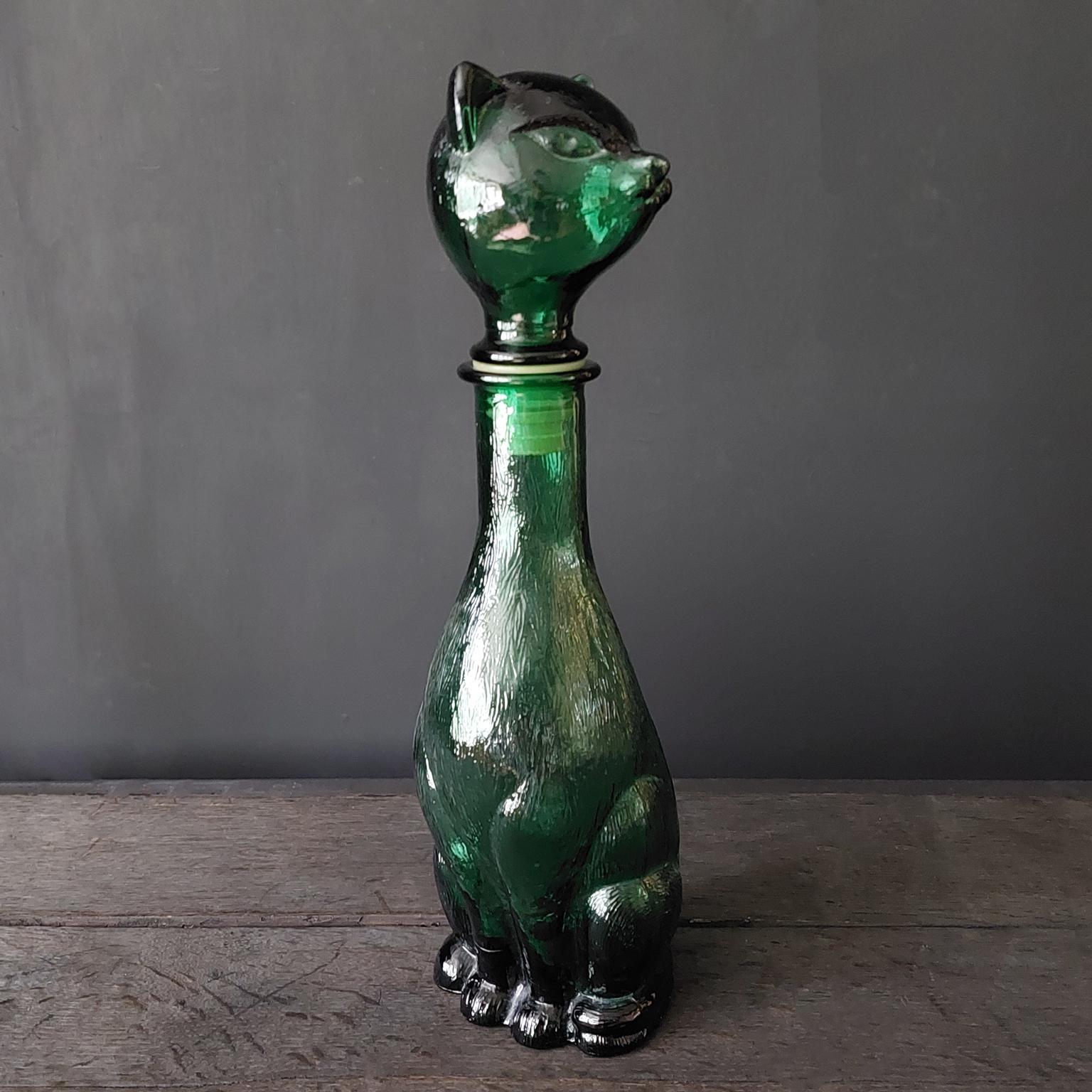 1960s Italian Empoli MCM green glass cute cat bottle.

Mention Italian glass and probably everyone’s mind immediately leaps to Venice and Murano. 
But there is another almost equally famous centre of Italian glass making known as Empoli.  

The