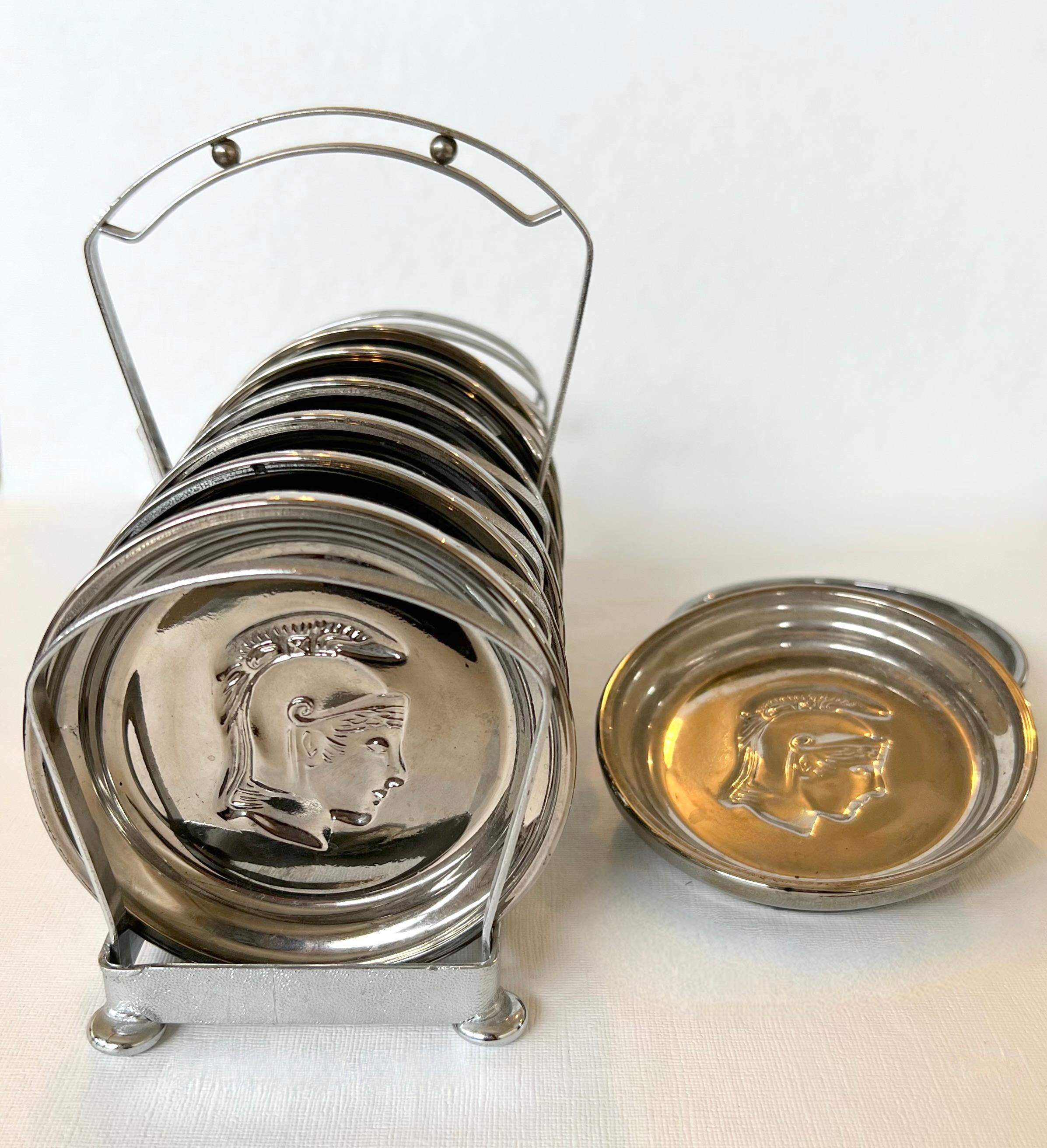 1960s Mercury Glass Roman Centurion Coasters in Caddy.  It includes eight coasters and one caddy with handle.  Each coaster has an embossed head of a Roman soldier or centurion - (a popular midcentury motif).  Perfect for the retro bar
