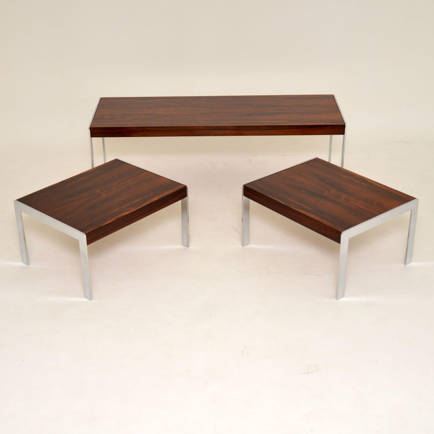 A stunning vintage nesting coffee table and side tables. These were made by Merrow Associates in the 1960s. They are made with wood tops and chrome legs, which beautifully contrast against each other. The quality is superb and the condition is