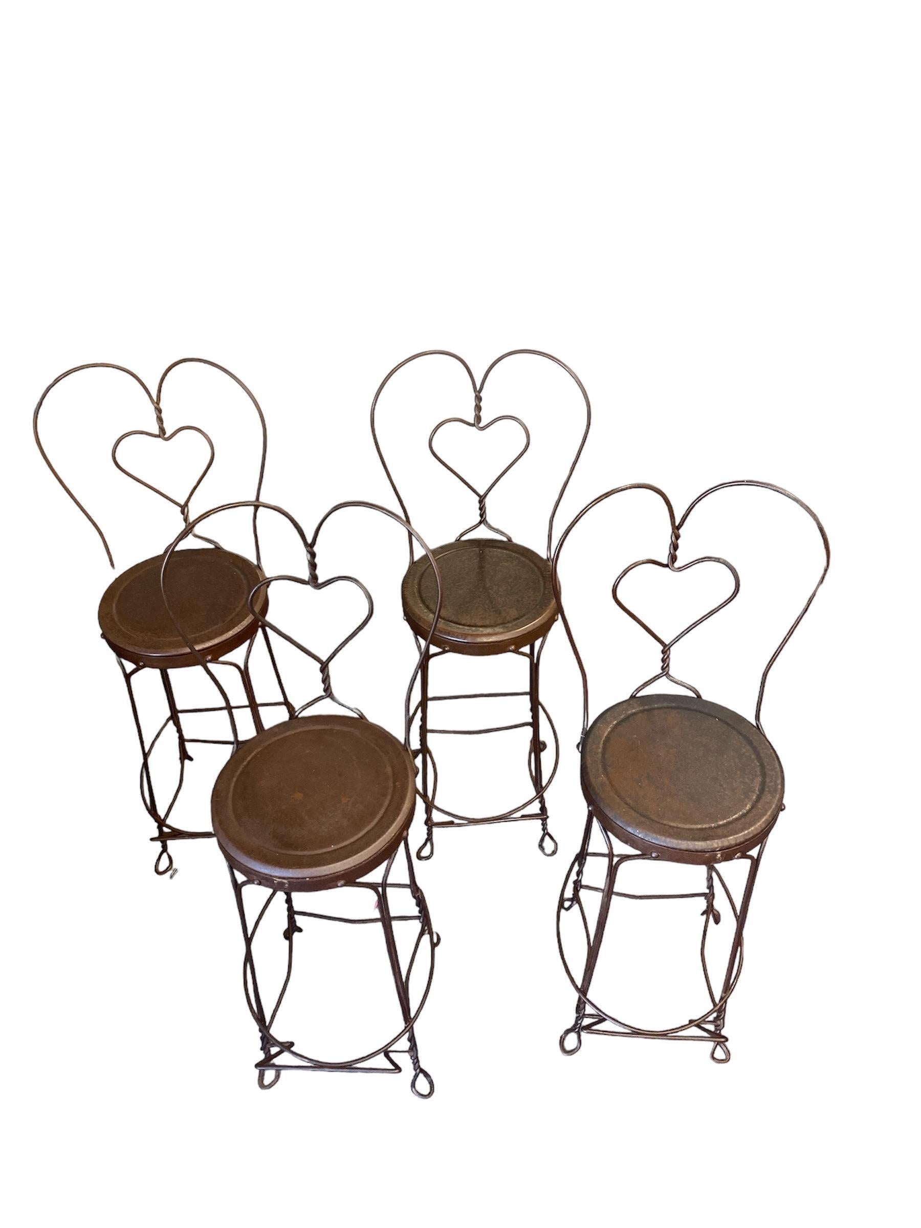 These wrought iron ice cream parlor bar stools are handmake by Craftsmen. These sturdy old fashion style bar stools have metal seating making them durable for many years. Each bar stool is a unique creation.