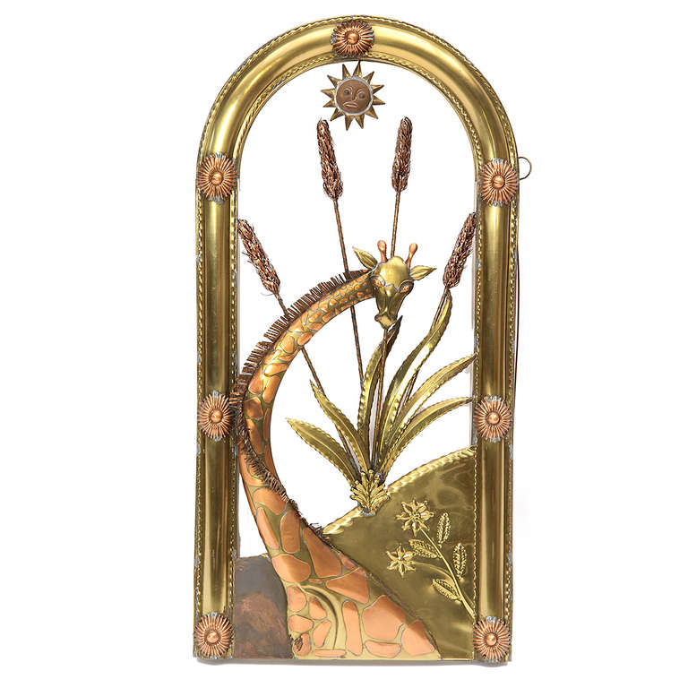 A unique tree-of life triptych sculpture beautifully rendered in repoussé and hand-formed copper and brass featuring an expressive and delightful array of flora and fauna.