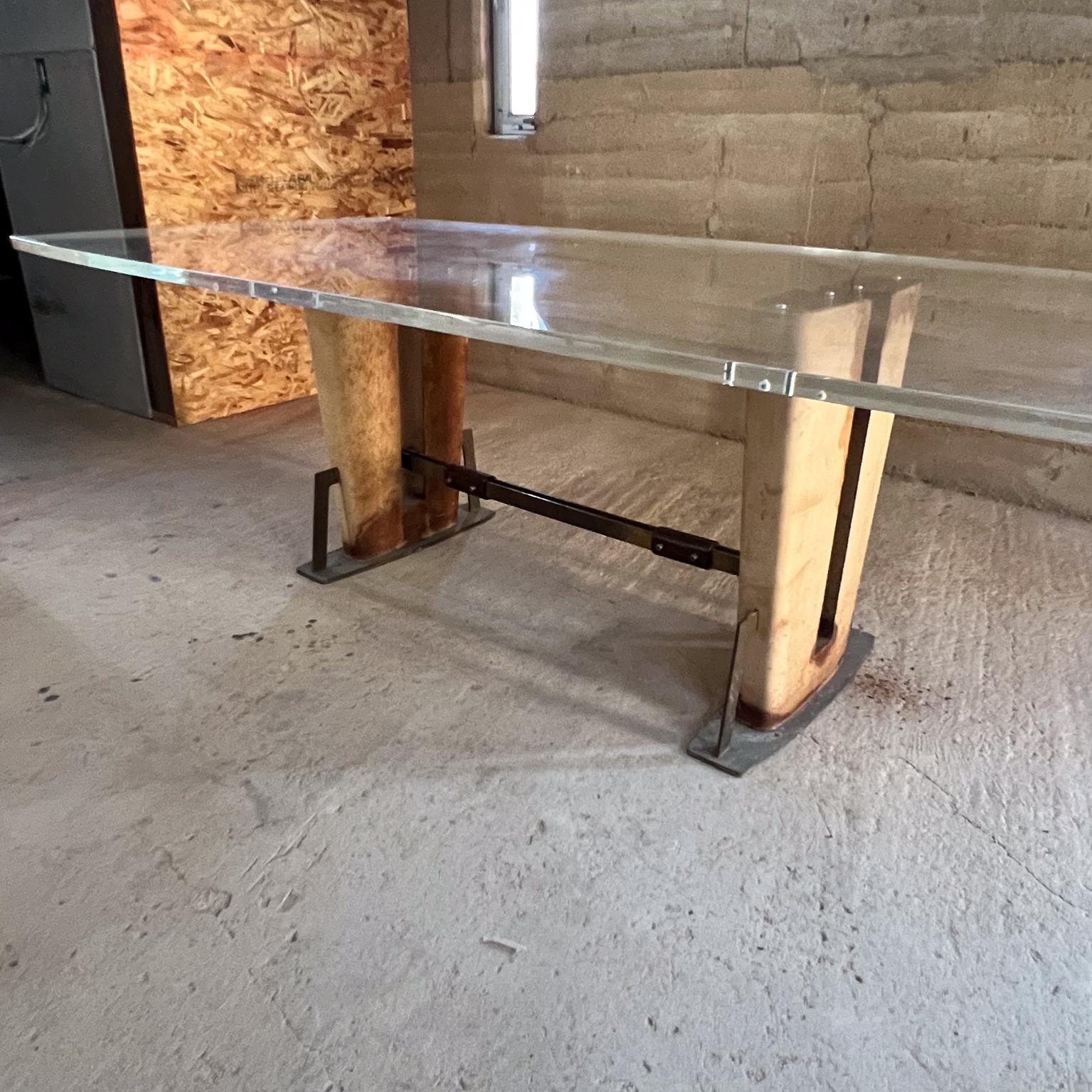 AMBIANIC presents
1960s Mexican modernism Sensational Dining Table
mahogany wood wrapped in leather solid brass hardware.
New lucite tabletop oval shape
Unsigned attribution Arturo Pani.
It is 1-inch-thick secured by eight (8) brass pegs.
Please