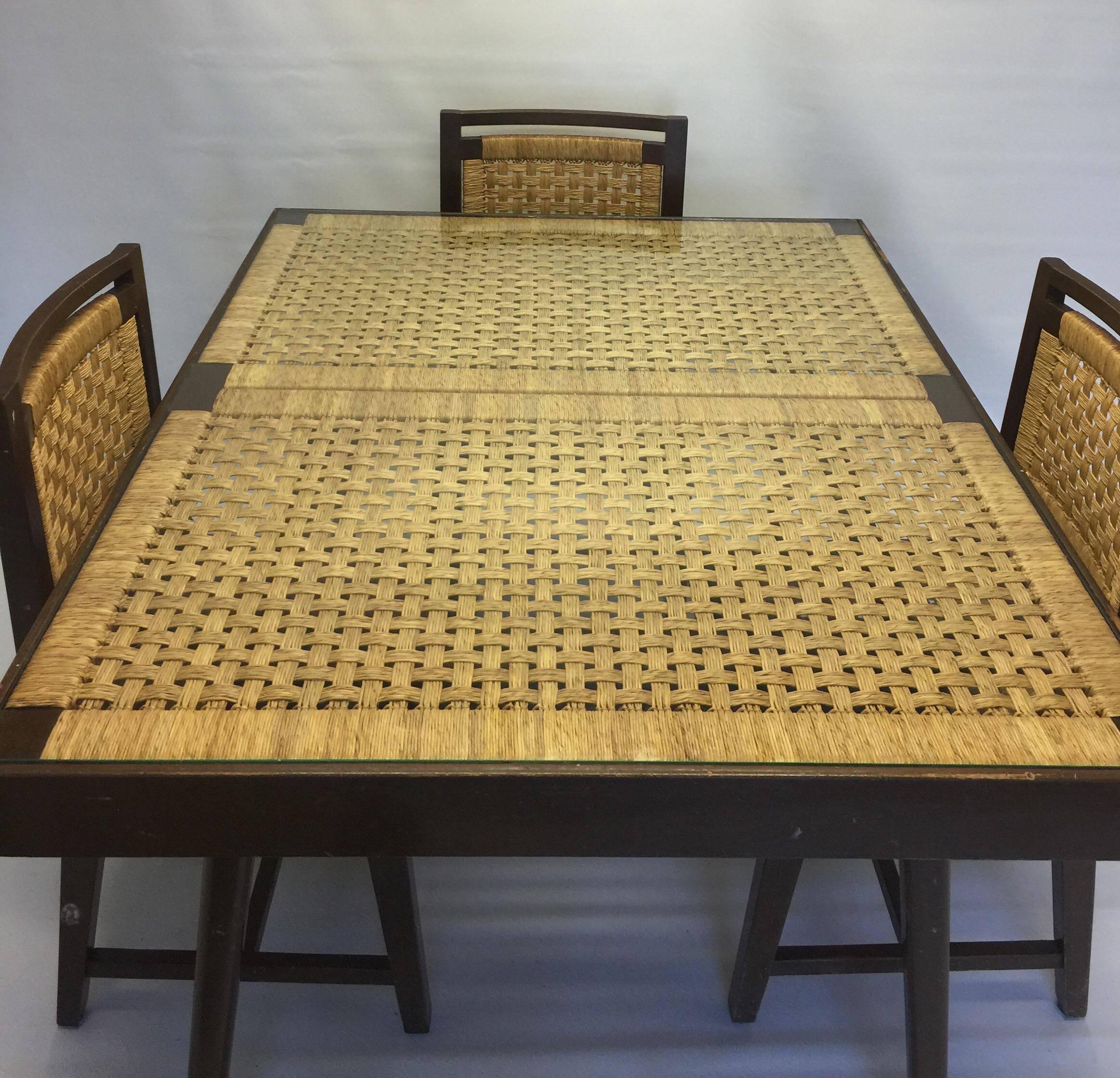 A rare 1960s Mexican modernist dining set, attributed to Michael Van Buren. Set consists of table with four matching chairs. All pieces are crafted from a mahogany-type wood with a walnut color stain/finish. Table top and chairs have a beautifully