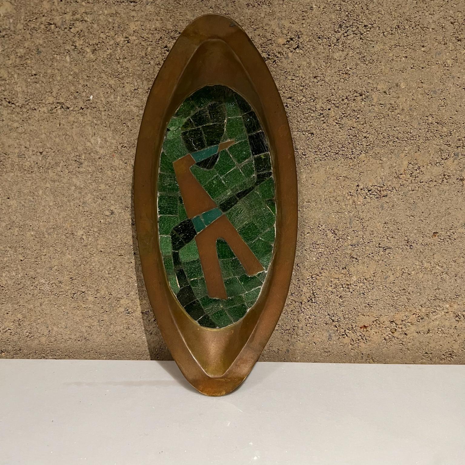Mexican wall art by Salvador Teran
Brass and green stone mosaic decorative dish - 
Handwrought wall art plaque by Salvador Teran, Mexico 1960s.
Maker stamp present.
1.75 tall x 12.5 wide x 5.75 deep
Preowned original unrestored vintage