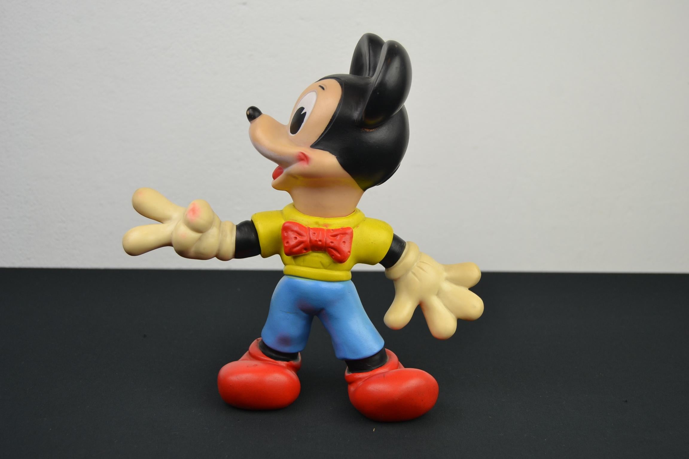 Mickey Mouse squeak toy doll by Walt Disney Productions. 
This rubber squeaky toy or squeek toy dates from the 1960s, the squeak still works. 
A beautiful Mickey doll which is also still complete with his tale. 
Beautiful condition with minor
