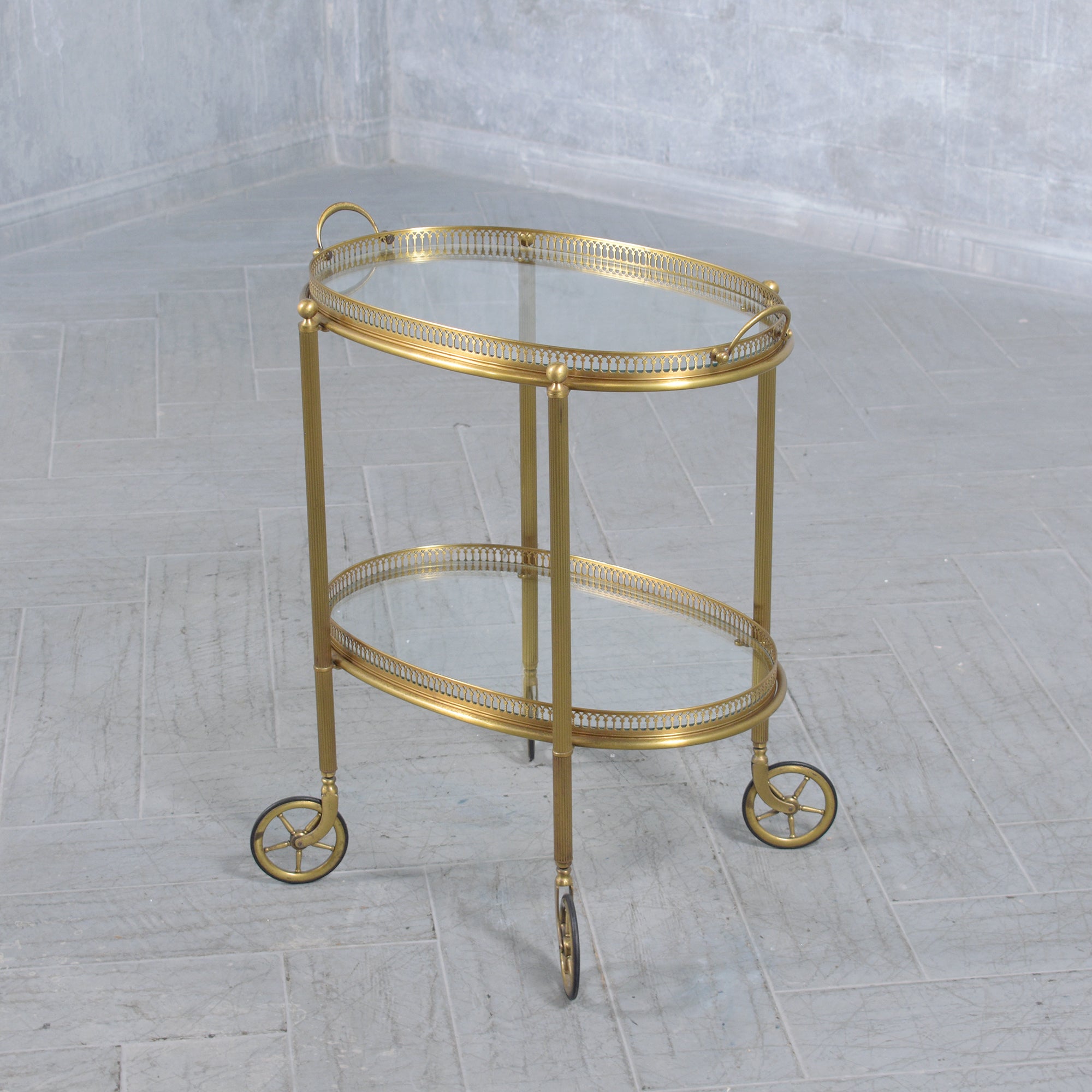 Journey back to the golden era of design with our 1960s brass bar cart, a masterpiece of mid-century elegance meticulously restored to its original splendor. Crafted with precision, this handcrafted brass piece showcases the exquisite craftsmanship