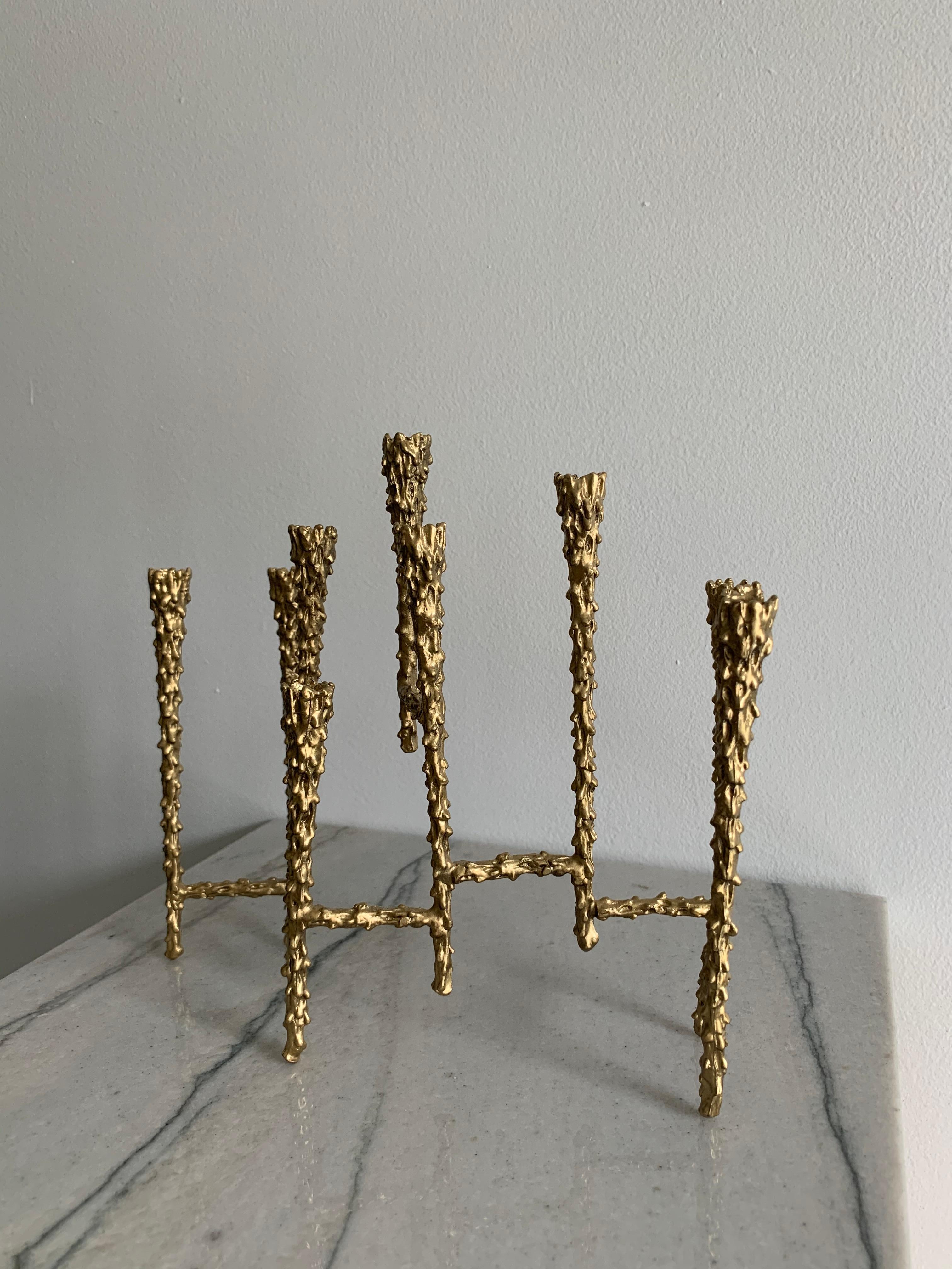 1960's Mid Century Brutalist Menorah/Candelabra made out of solid brass. Handcrafted with a melted brass look with a tiered design.

Dimensions:
9