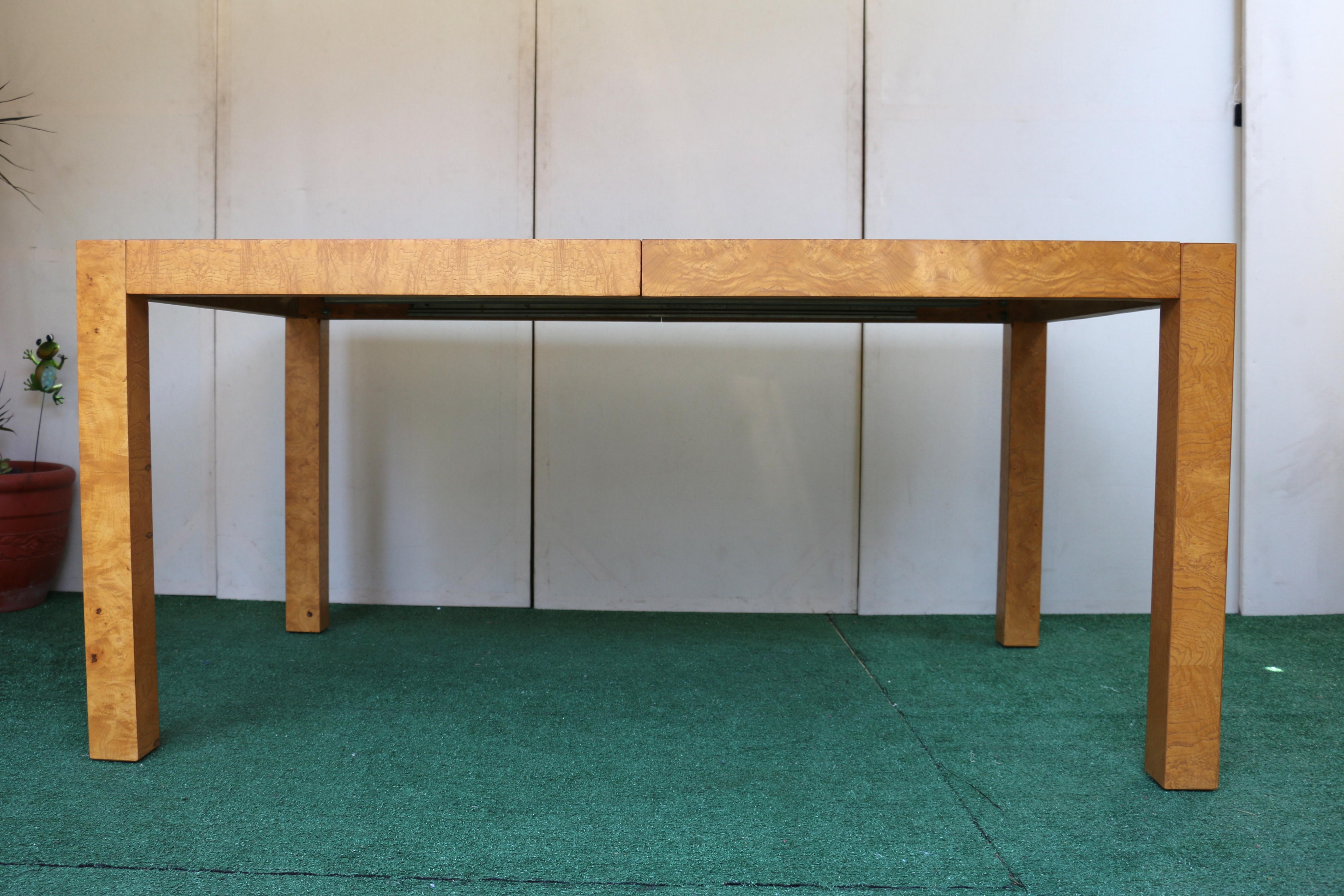 Stunning Burl Parsons Dining Table. This table style is characterized by its simple, clean lines and the prominent use of burl wood veneer. It is a Mid-Century Modern design, from the 1960’s. The 