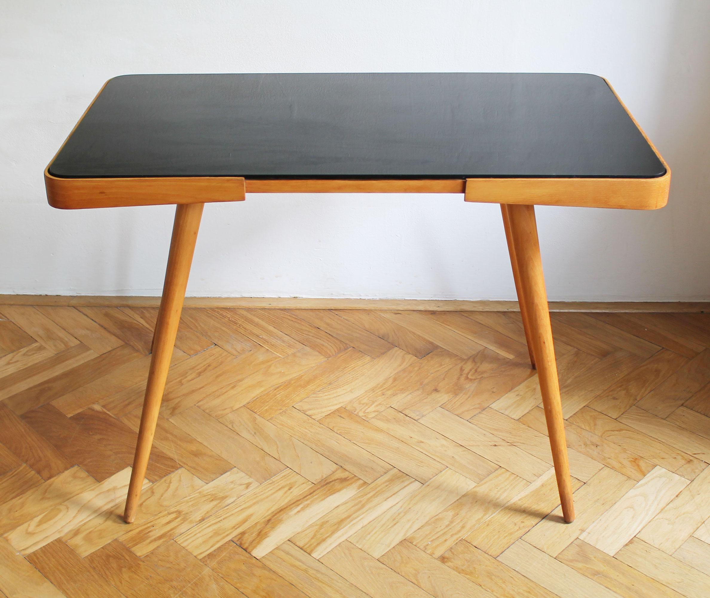 This is another design classic of the so called 'Brussels Style', a popular design style adopted by many Czech households. 

This Coffee Table is believed to be created by a celebrated Czech furniture designer Jiri Jiroutek (1928-2023) and was