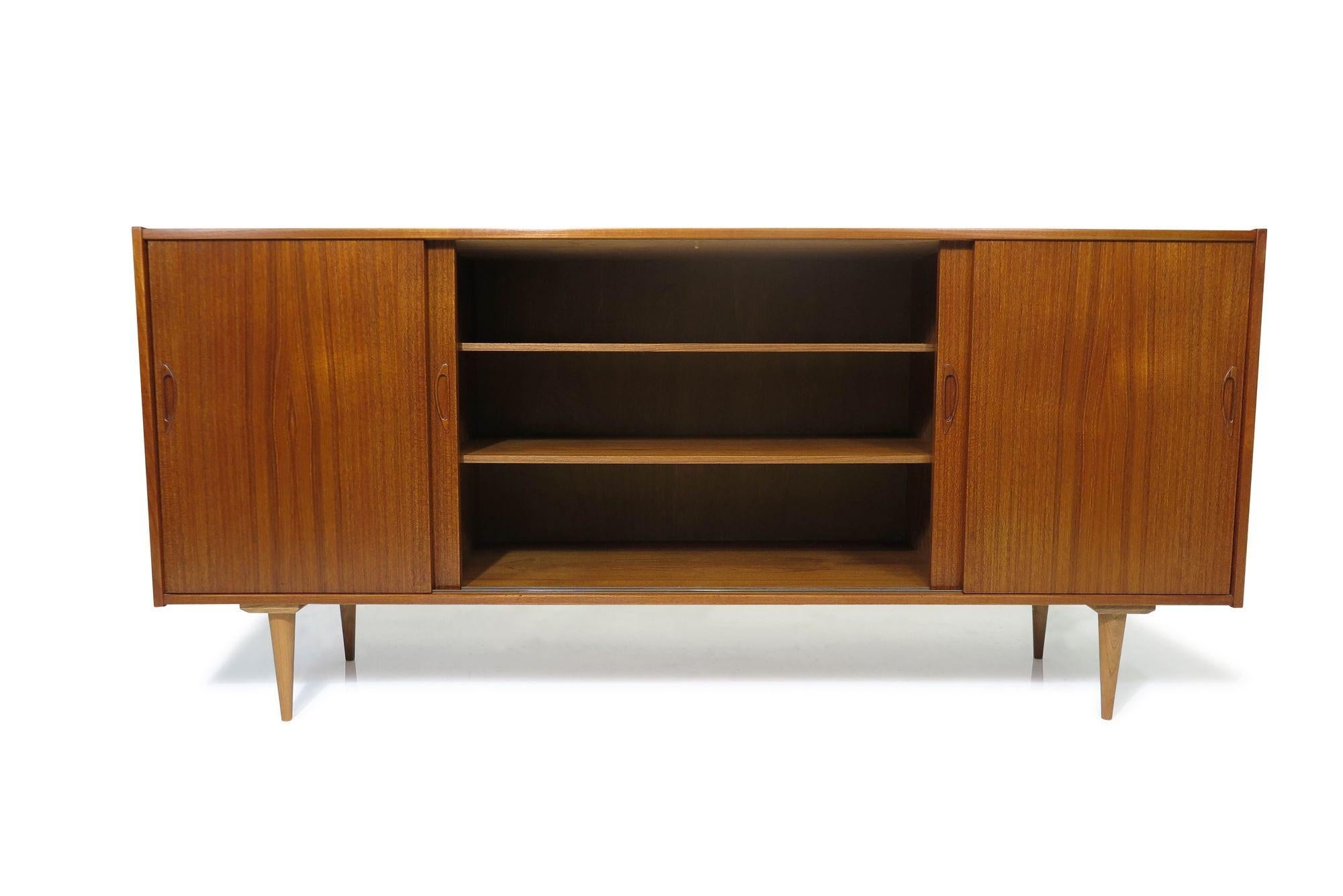 Oiled 1960's Mid Century Danish Teak Credenza With Four Sliding Doors For Sale