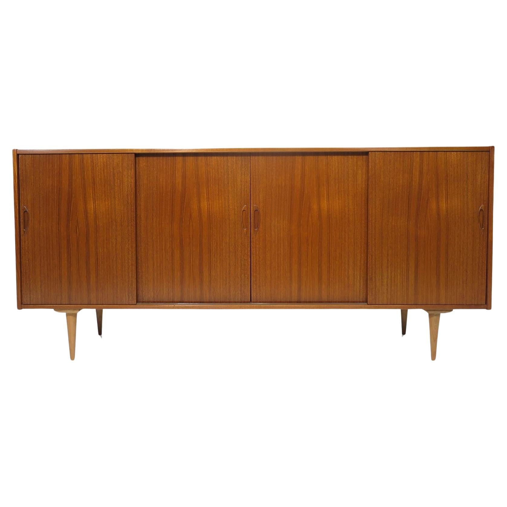 1960's Mid Century Danish Teak Credenza With Four Sliding Doors For Sale