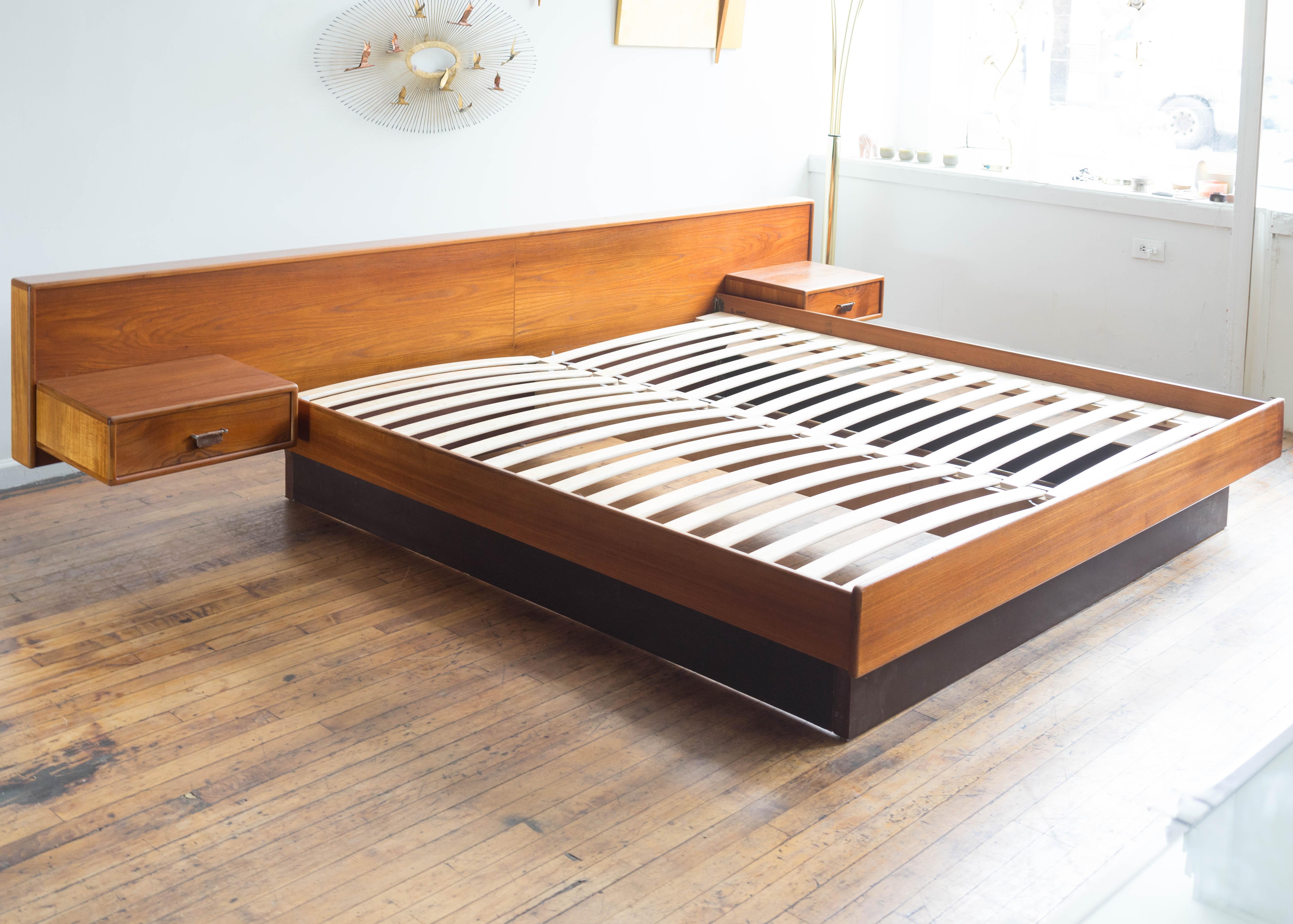 Gorgeous and dramatic king sized platform bed with floating nightstands made in Denmark. Features a headboard just over 10 feet wide and room for a modern king mattress. Two floating nightstands easily attach with a hidden cleat. Each nightstand has