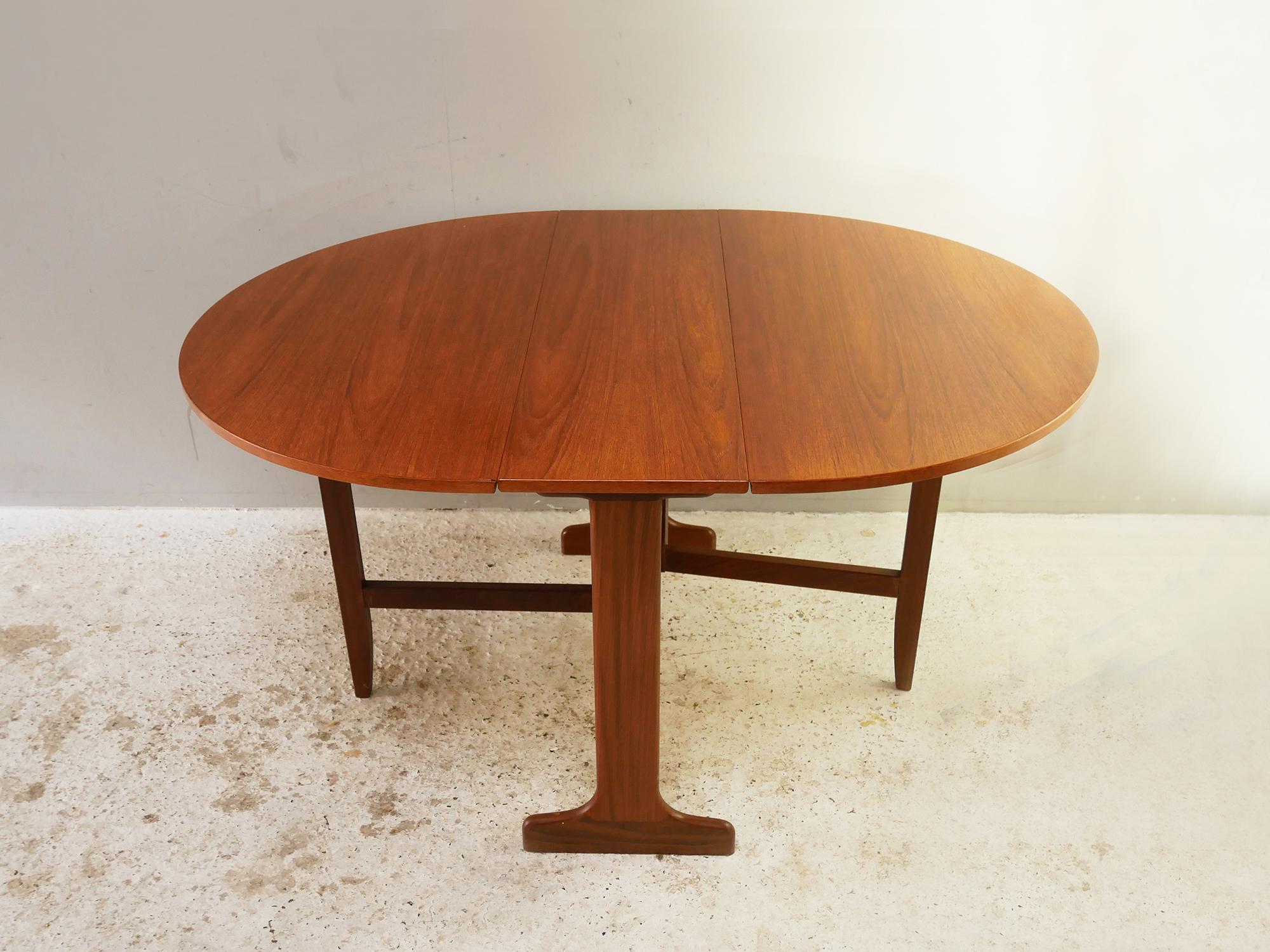 Ideal for a small space. A good sized extending dining table for the kitchen or the dining room. Two drop down sections allow 3 different sizes. When both flaps are down it is very narrow easy to store away. In fantastic condition with lovely warm