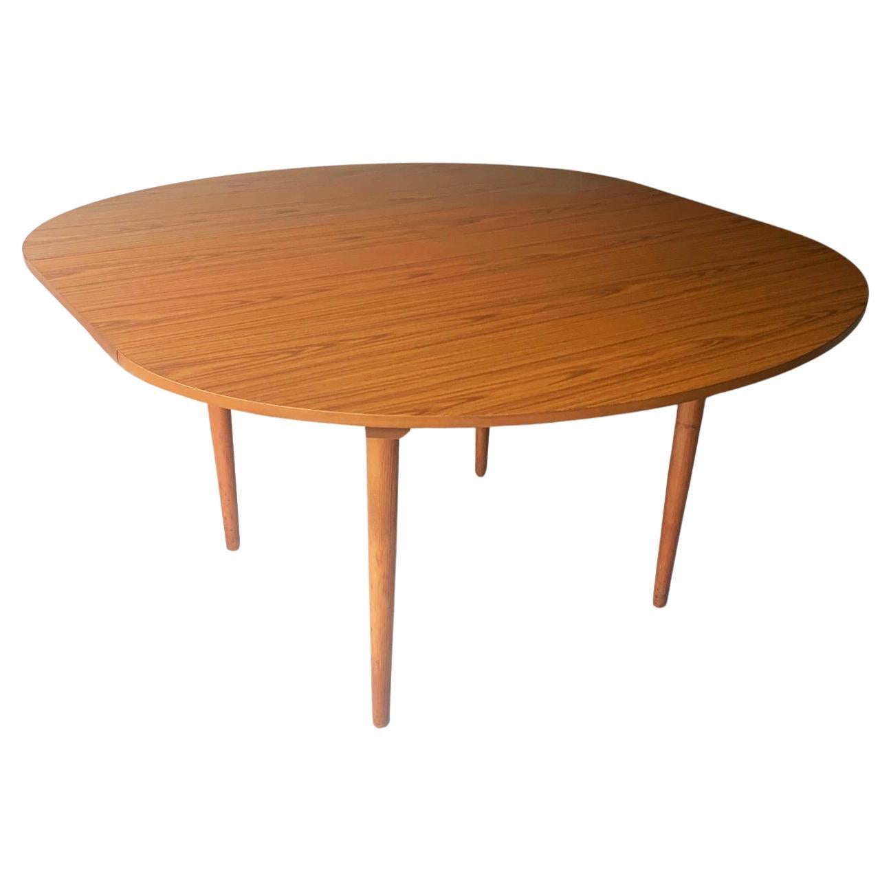 1960’s mid century Formica extending dining table by Schreiber For Sale