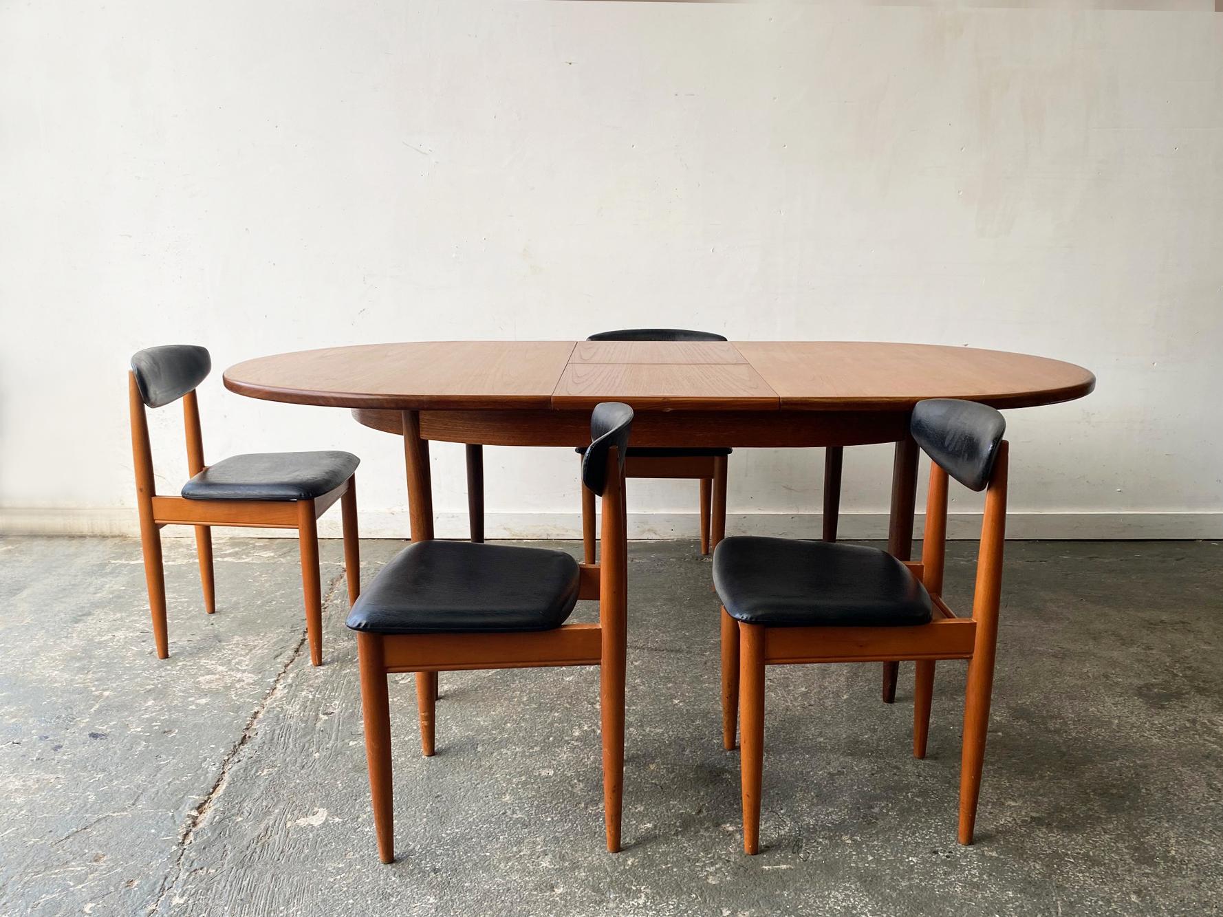 A mid century modern extending G Plan dining table, matched with 4 Schreiber Furniture dining chairs.

A classic G plan ‘Fresco table’ designed by Victor Wilkins. Designed in minimalist Danish style, with clean lines and gently tapering