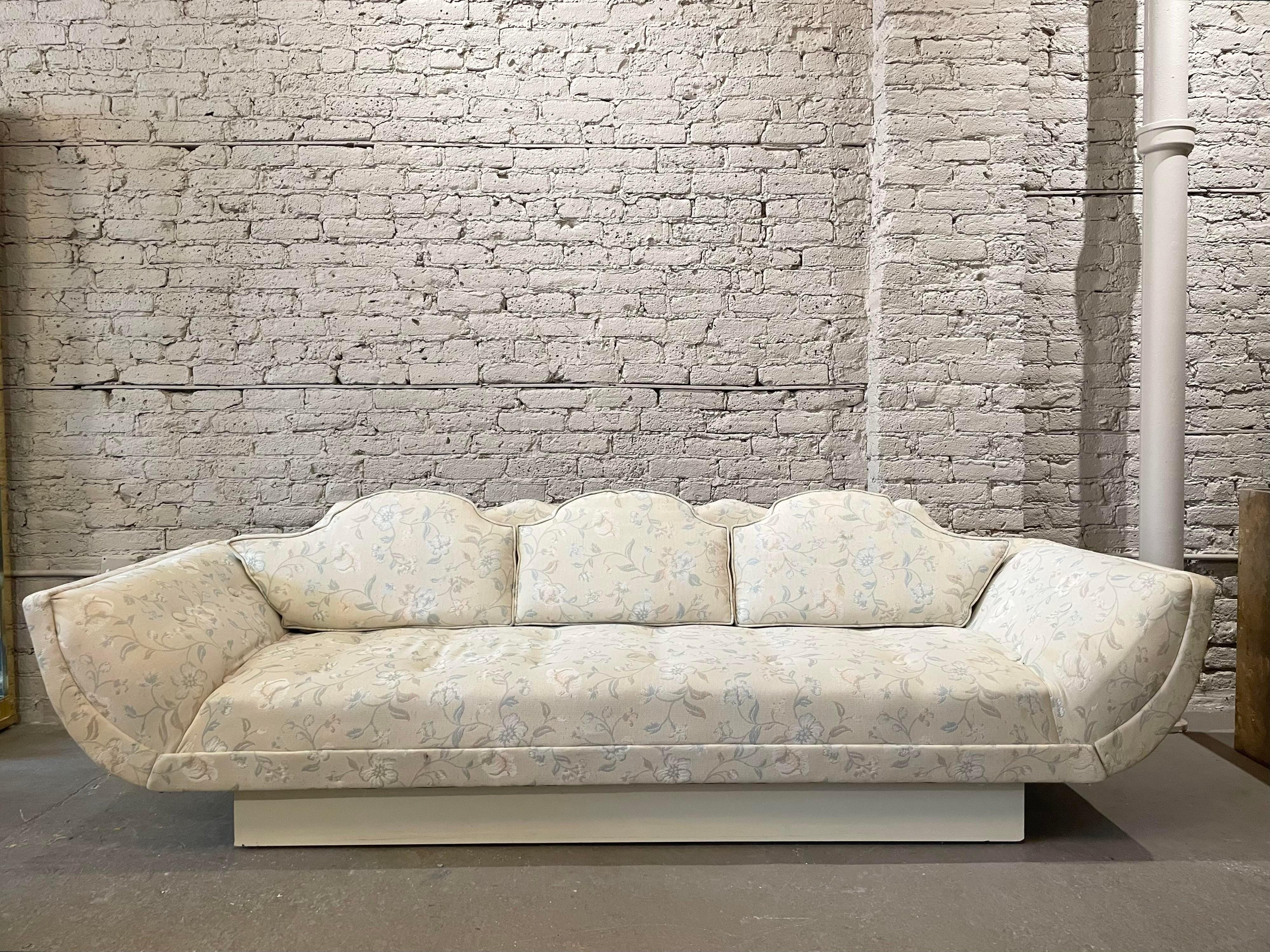 Amazing sofa with the coolest lines. In the manner of Adrian Pearsall but no tags to indicate so. Use as is or redo in your favorite fabric. The plinth base is painted wood.