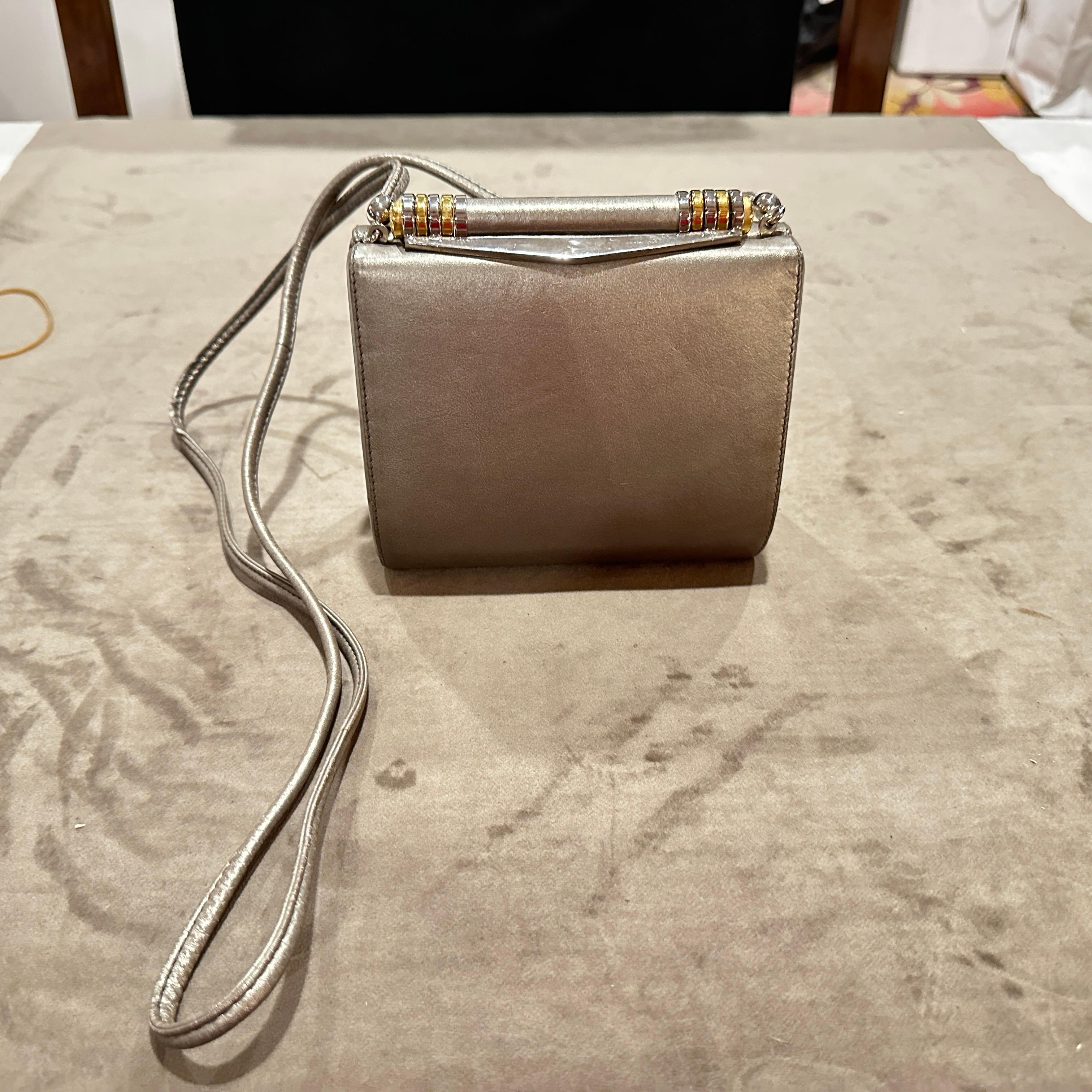 Chic 1960s Mid-Century Gray Leather Italian Minaudière Bag by Rodo
This sophisticated bag embodies the refined elegance and understated luxury that defined the era, making it a timeless accessory for the discerning collector.
Crafted from supple