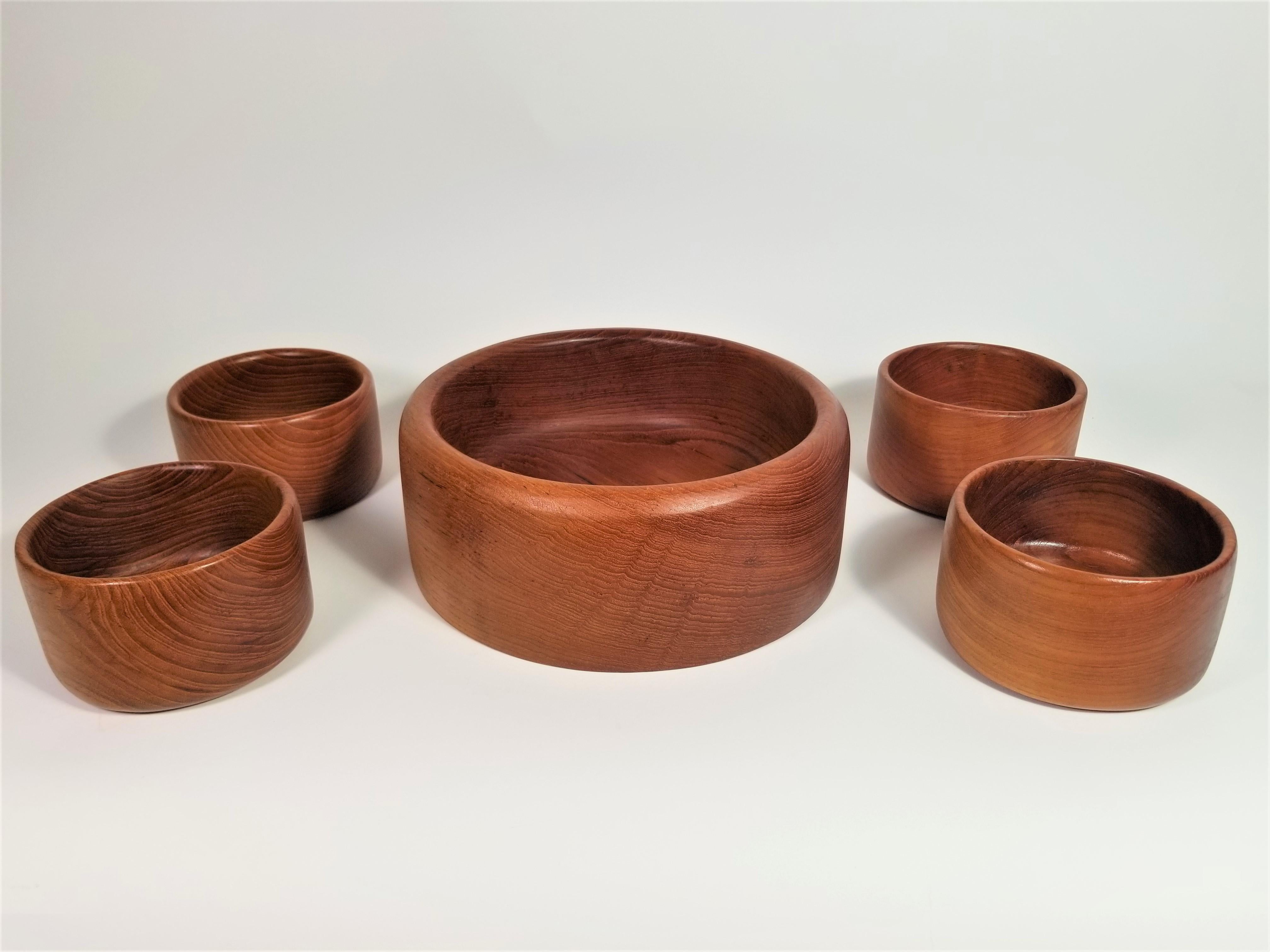 1960 midcentury hand-turned teak bowl set. 5 piece includes 1 large bowl and 4 small bowls. Excellent condition.
Measurements:
Large bowl height: 4.0 inches
Large bowl diameter: 10.25 inches
Small bowls height: 3.0 inches
Small bowls diameter: