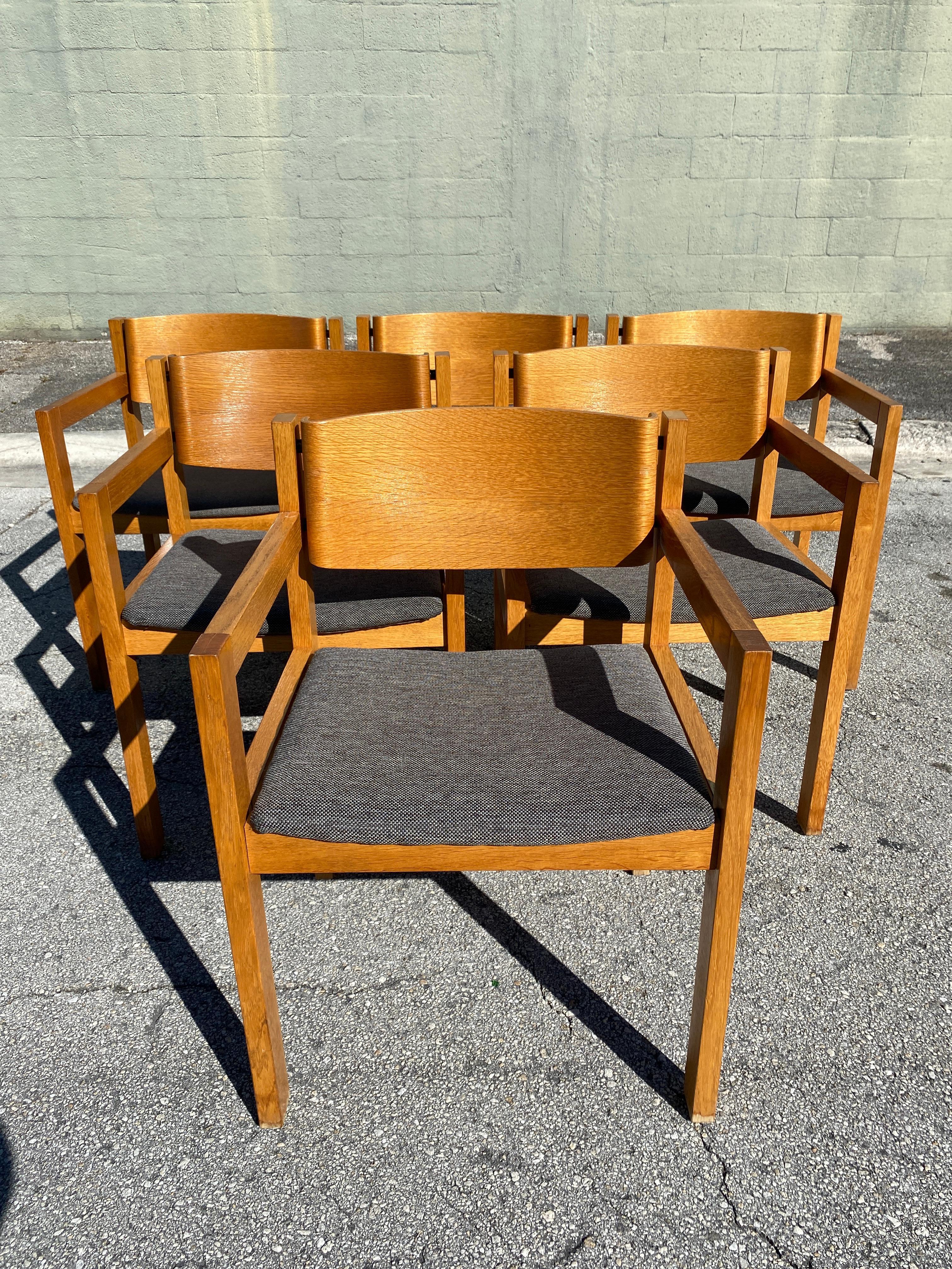 Set of six bent mahogany arm chairs, retailed by Harvey Probber, each one with flat bar arms and solid ribbon back and newly upholstered seats.

Measures: 21.5” W x 19.5” D x 29.5” H x 18”Seat H x 18.5”Seat W x 17 Seat D.