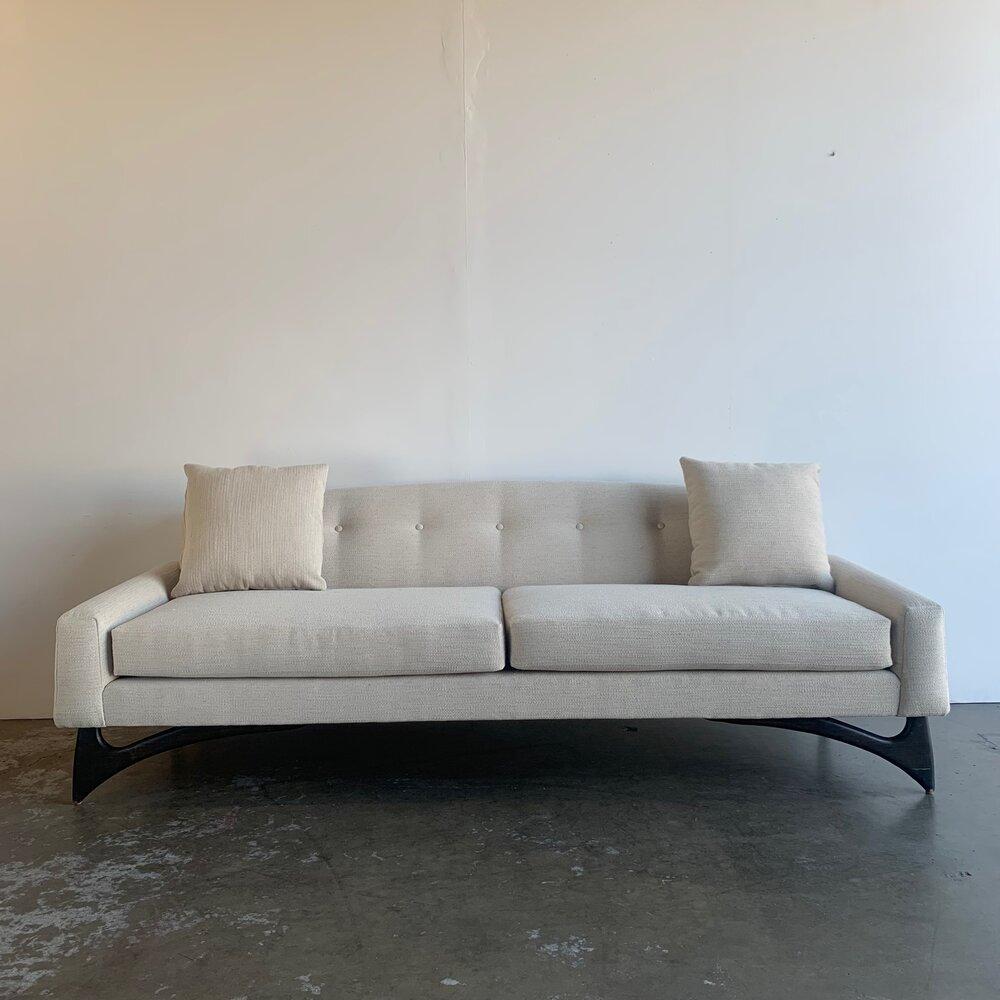 Mid century sofa with new upholstery, in good restored conditions. 
SW76 // SD24 // SH19.5 // AH2.3.