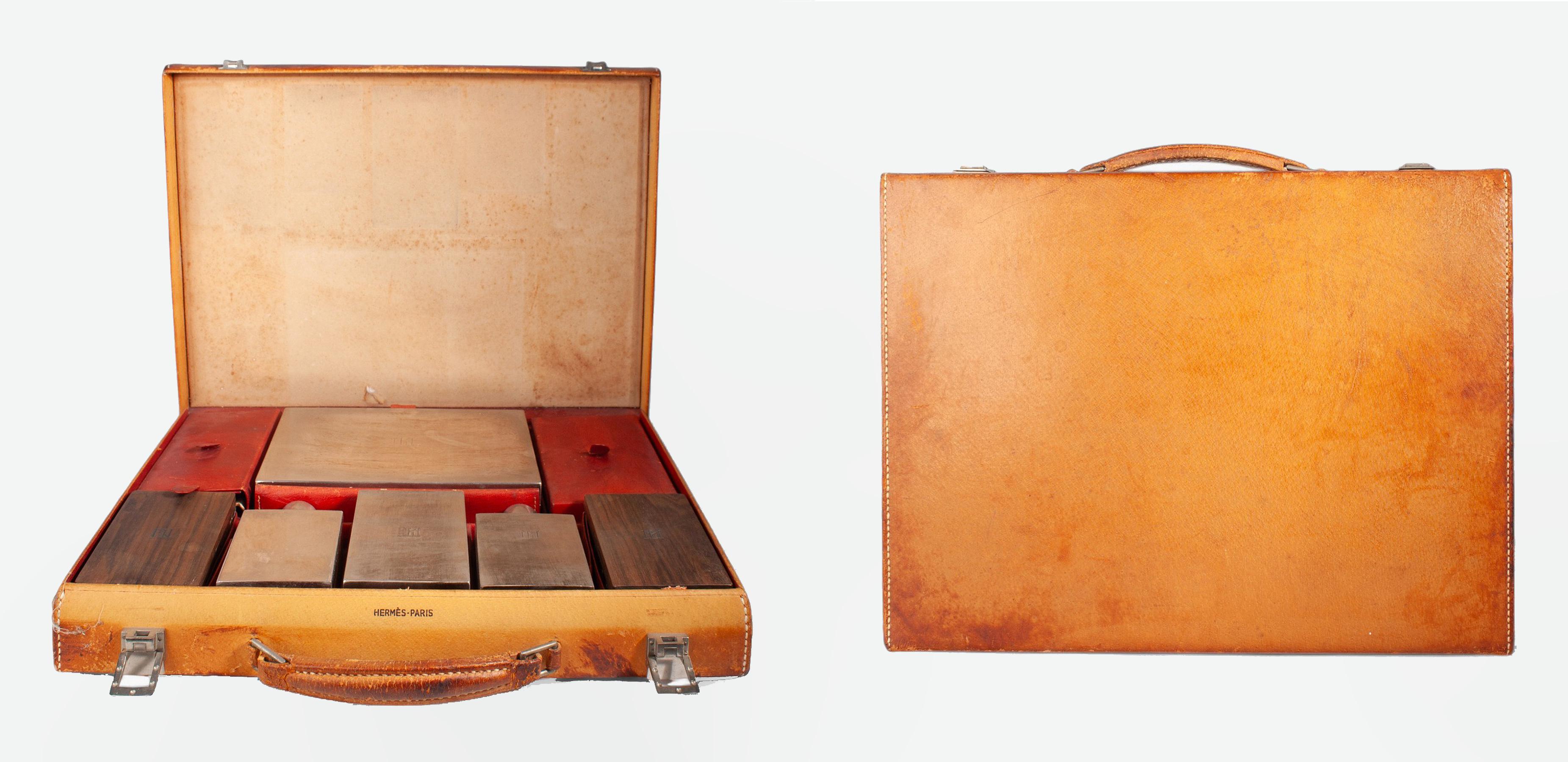 1960s Mid-Century Modern leather travel case with vanity/grooming set by the luxury brand Hermès Paris, France

By: Hermès Paris
Material: metal, leather, wood
Technique: carved, cast molded, metalwork
Dimensions: 11 in x 14.5 in x 2.5 in
Date: