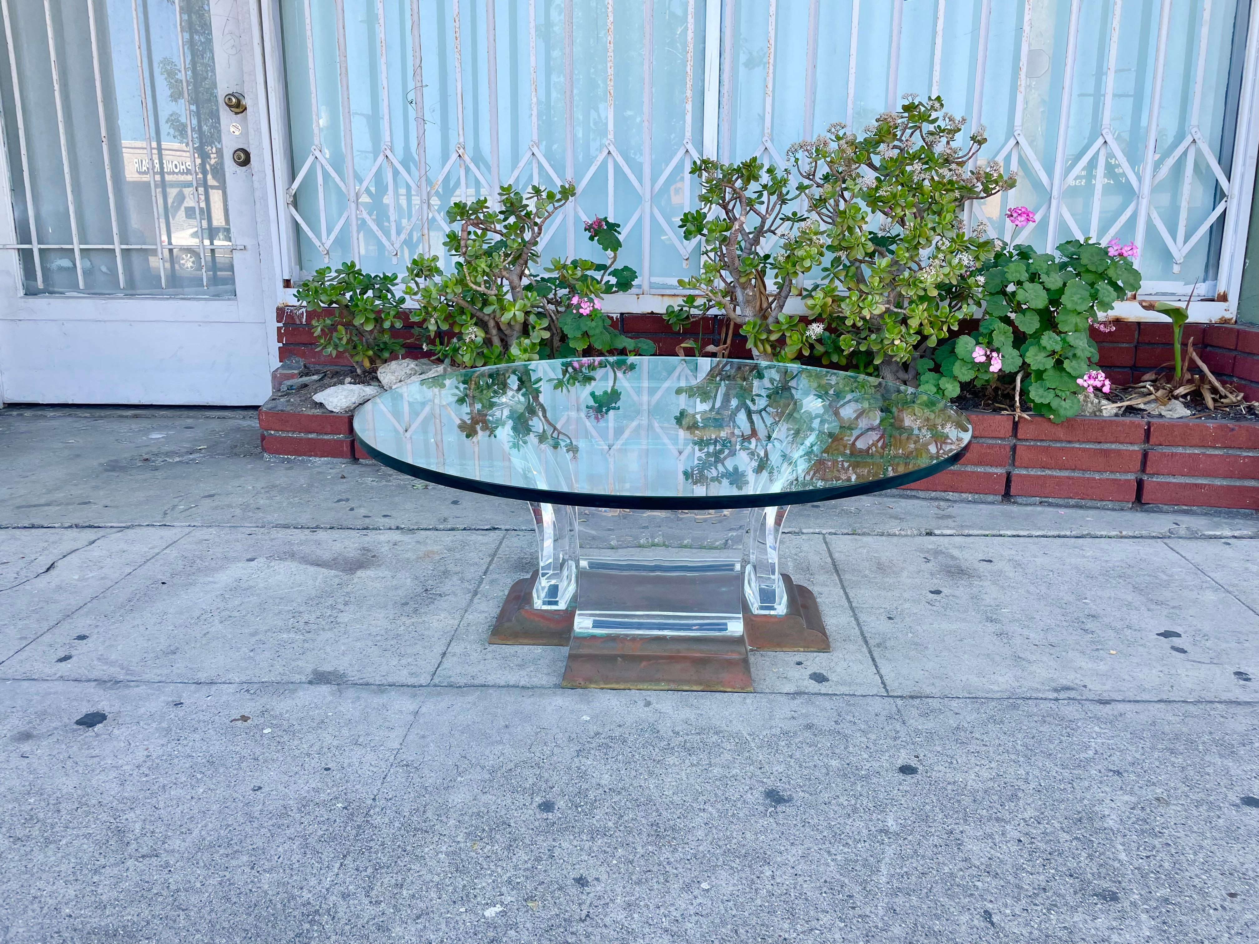 Beautiful Lucite & brass coffee table by Jeffery Bigelow, This Stunning Coffee table is just so unique and one of a kind; it features a beautiful brass base that does have patina giving it a great characterization to the piece has four thick lucite