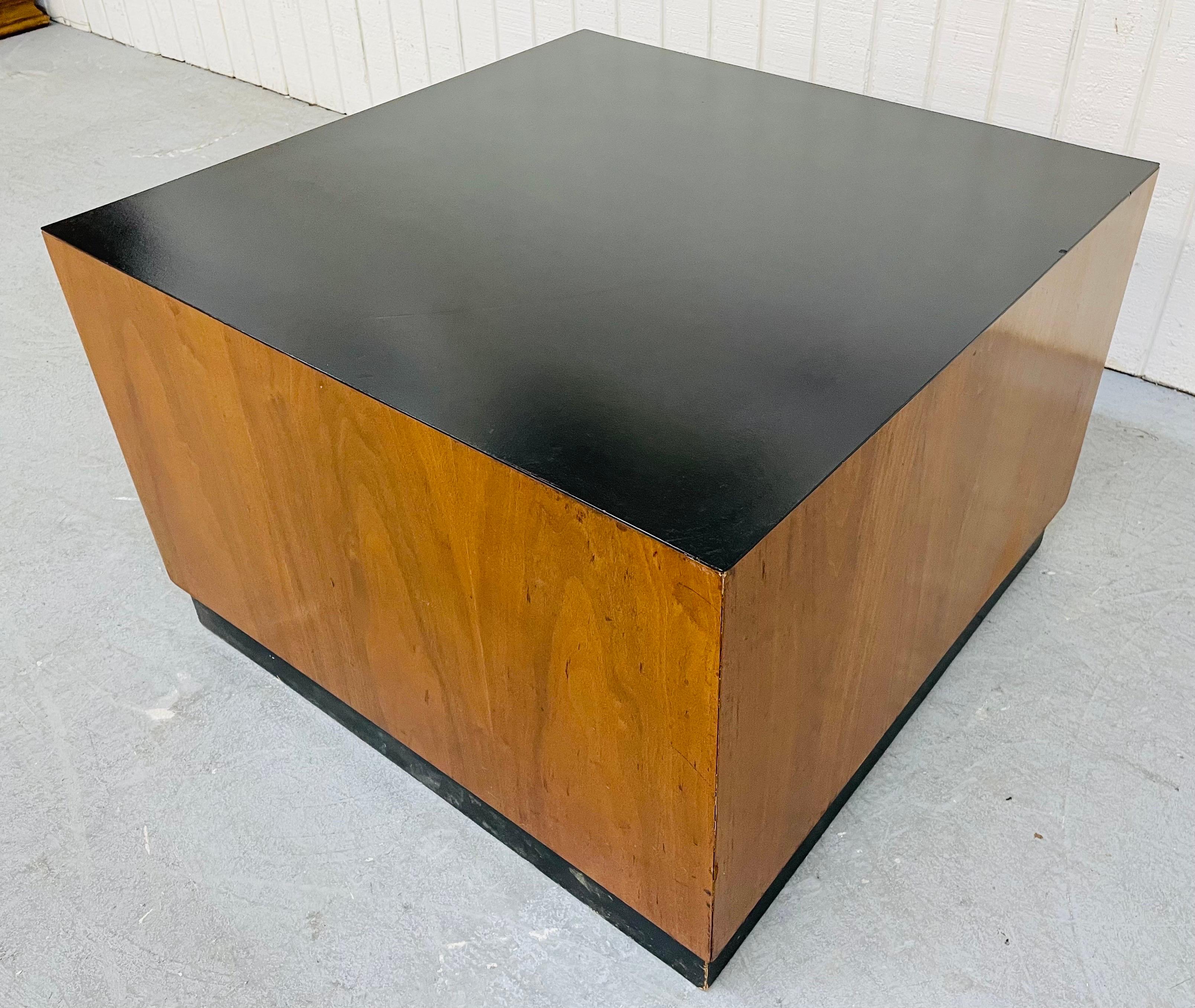 This listing is for a Mid-Century Milo Baughman Style Walnut Cube Coffee Table. Featuring a black laminated square top, walnut cube body, and black plinth base.
