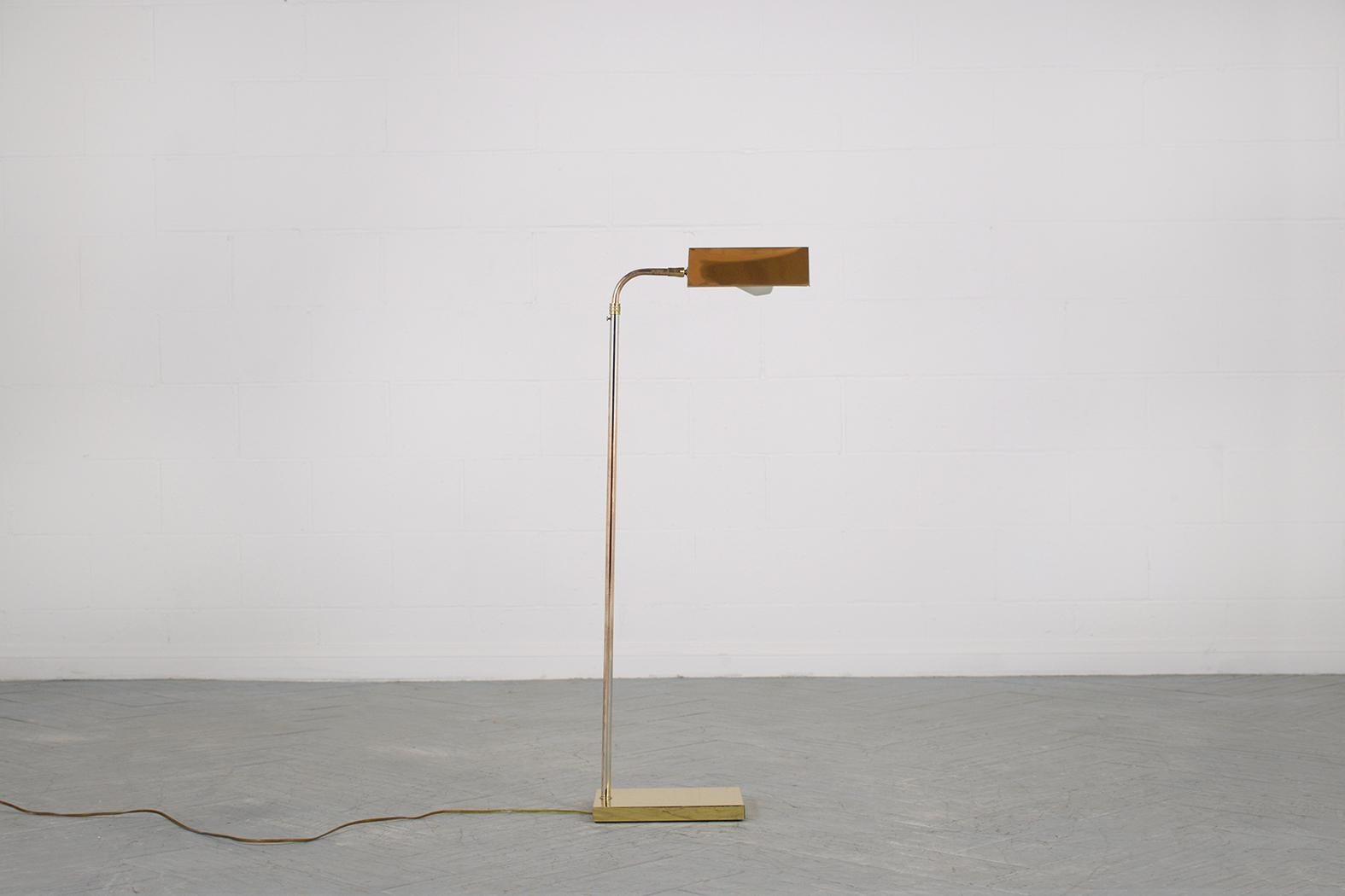 Illuminate your space with a touch of mid-century magic. Introducing our vintage adjustable brass floor lamp from the 1960s, expertly restored to its original splendor by our dedicated craftsmen. Boasting articulated heads, the lamp offers