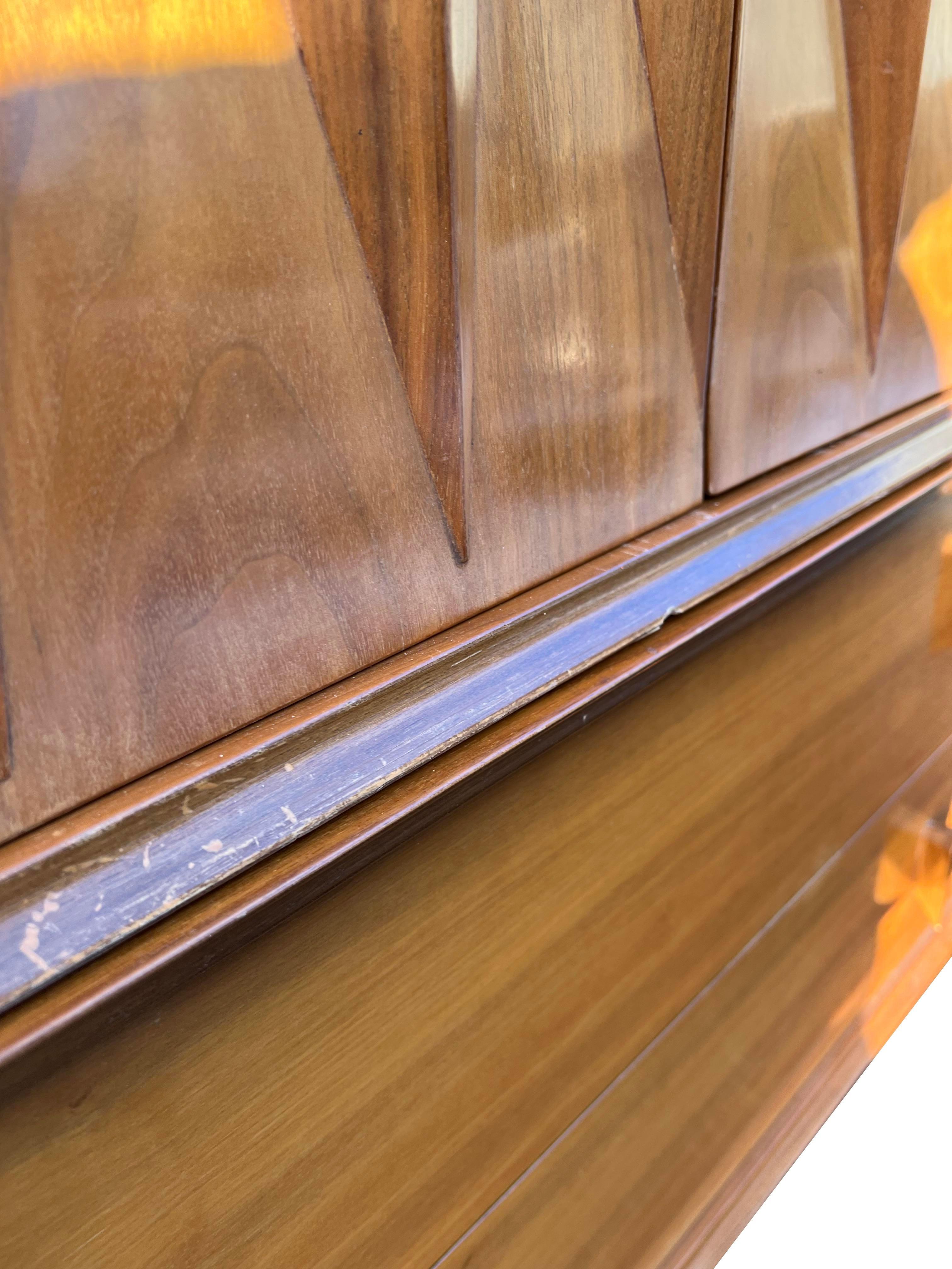 Rare Mid-Century Modern Albert Parvin Style Dresser Sculpted Design.

Elevate your bedroom with this stunning Rare Mid-Century Modern Albert Parvin Style Dresser Sculpted Design. This iconic piece showcases the distinctive design aesthetic of the