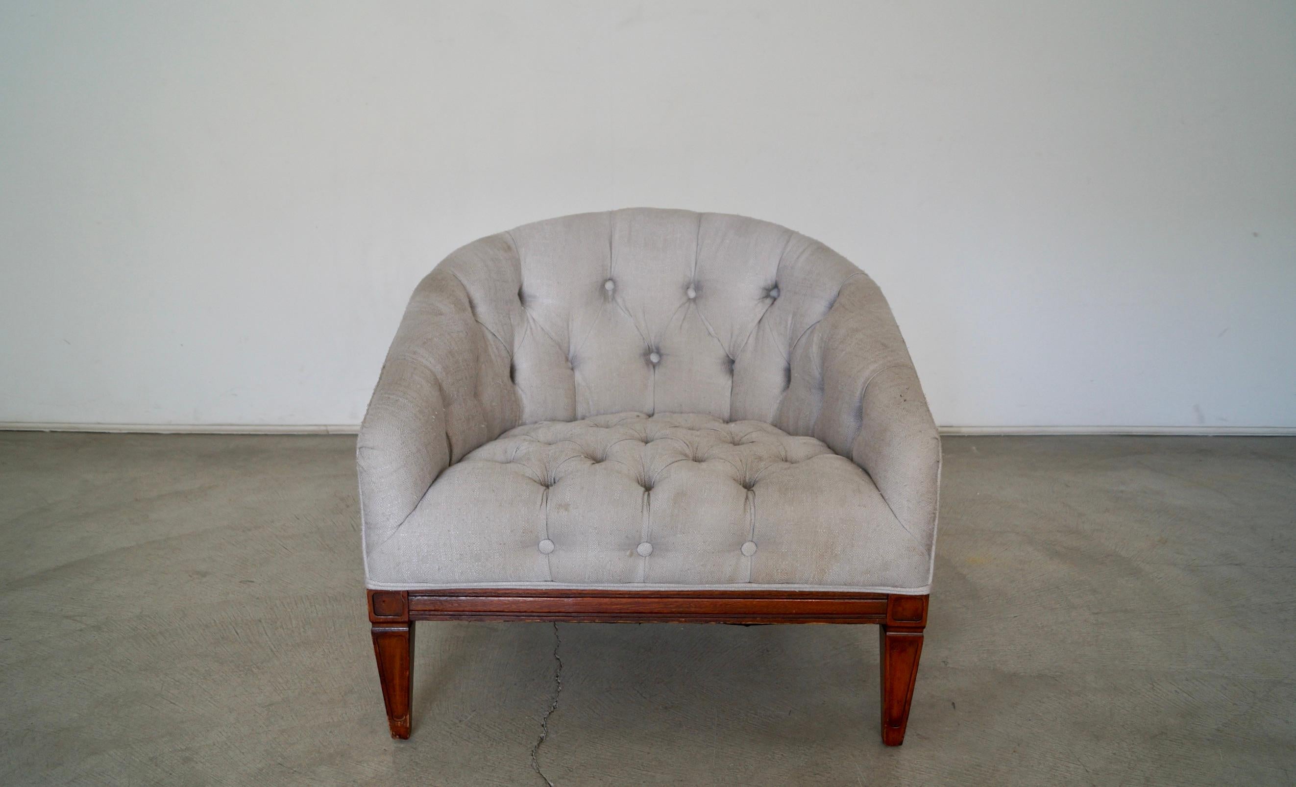 Vintage barrel-back Mid-Century Modern club chair for sale. Very solidly built, and very comfortable. It's a tufted chair, and needs to be reupholstered. It has a solid wood base with tapered legs, and has springs on the seatrest. It's a great