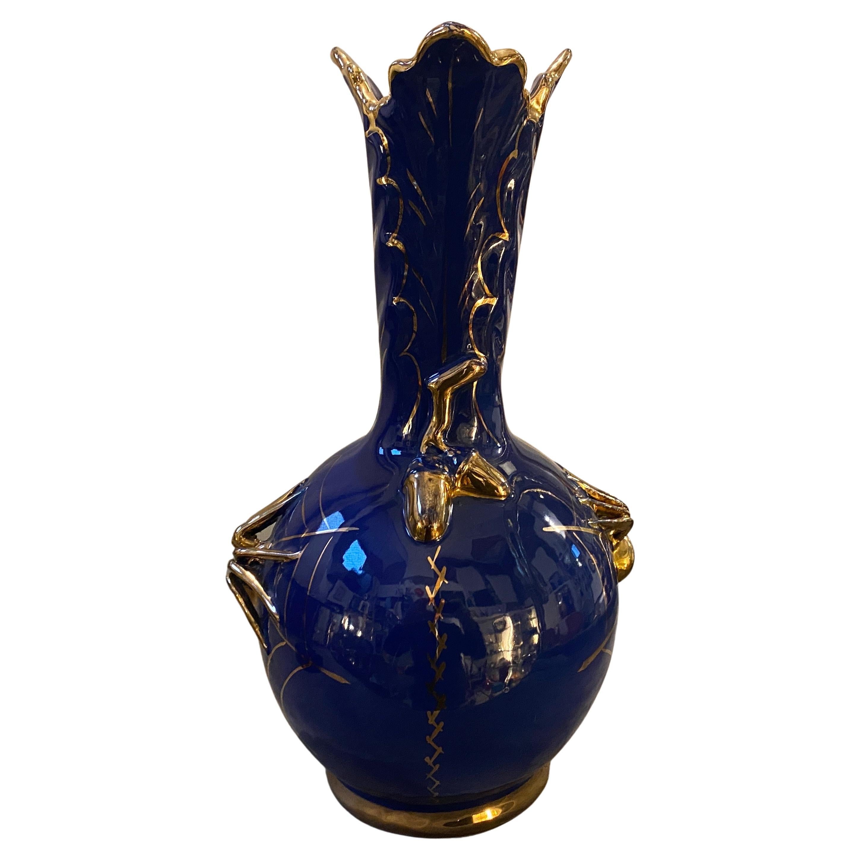 A mid-century modern blue and gold ceramic vase designed and manufactured in Gualdo Tadino, small town in Italy, famous for hand-crafted ceramics, by Nuova Mastro Giorgio in the Fifties. This Spider Vase is a captivating piece of art that