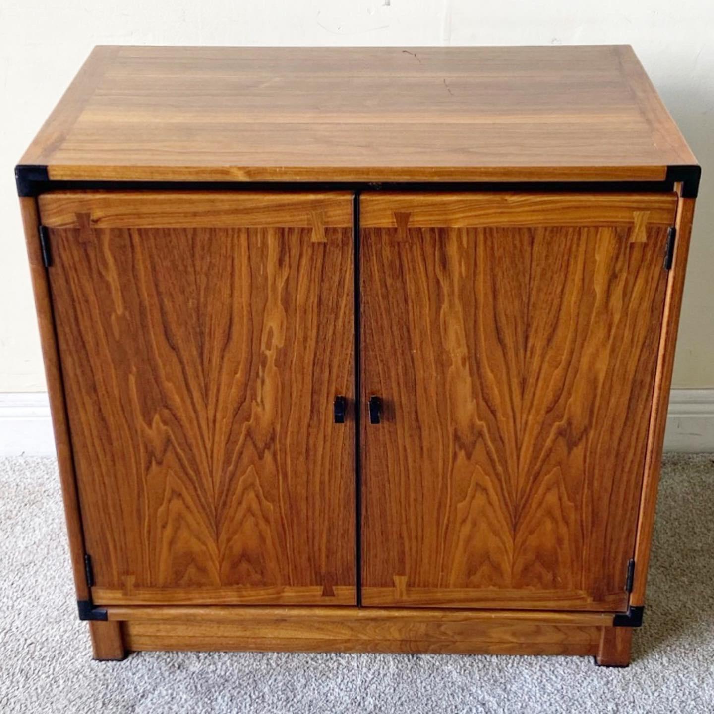 Amazing wooden cabinet by Drexel Heritage. Veneer features a bow tie inlay framing the cabinet doors.
 