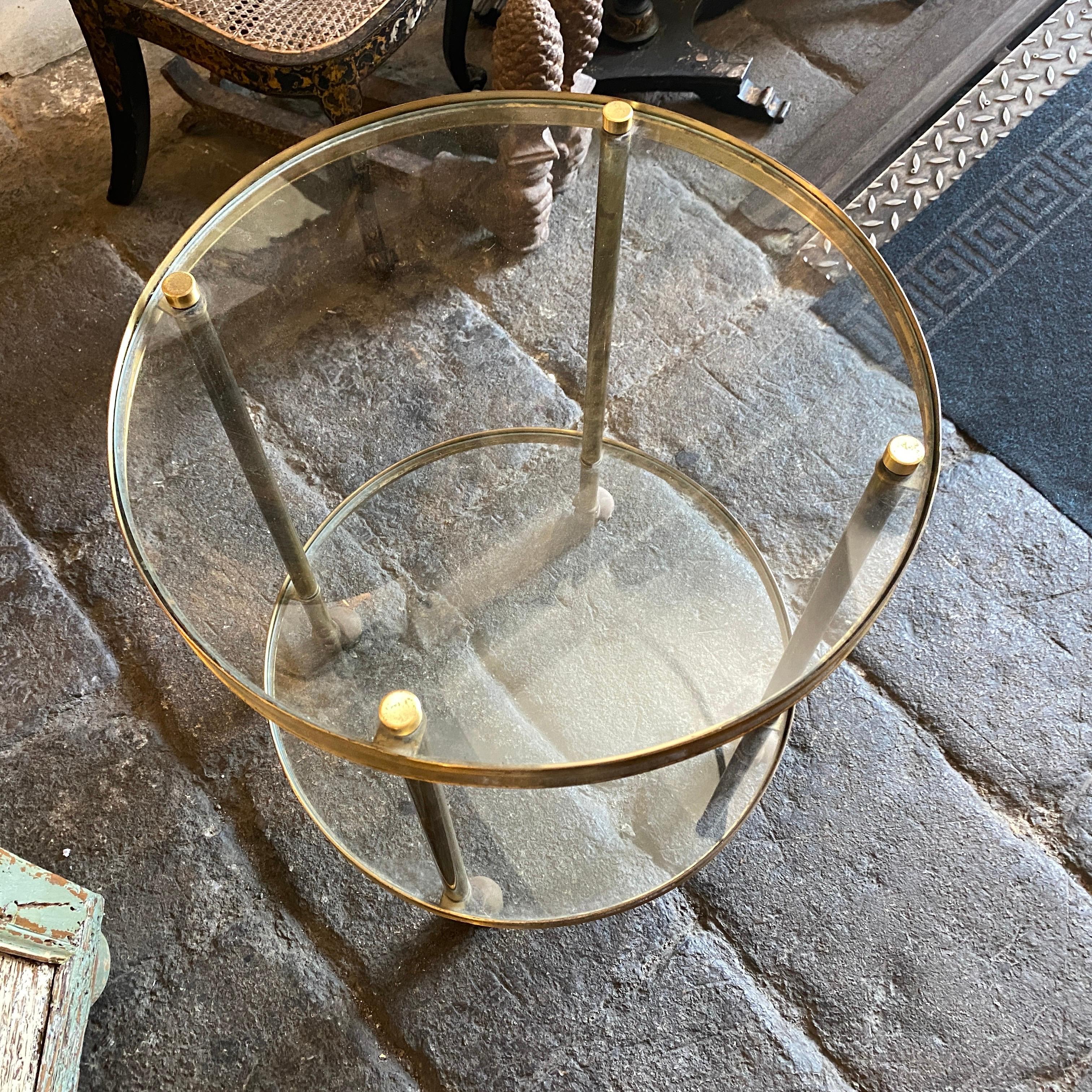A brass bar cart made in Italy in the style of Fontana Arte, heavy glass it's in perfect conditions, brass it's in original patina.