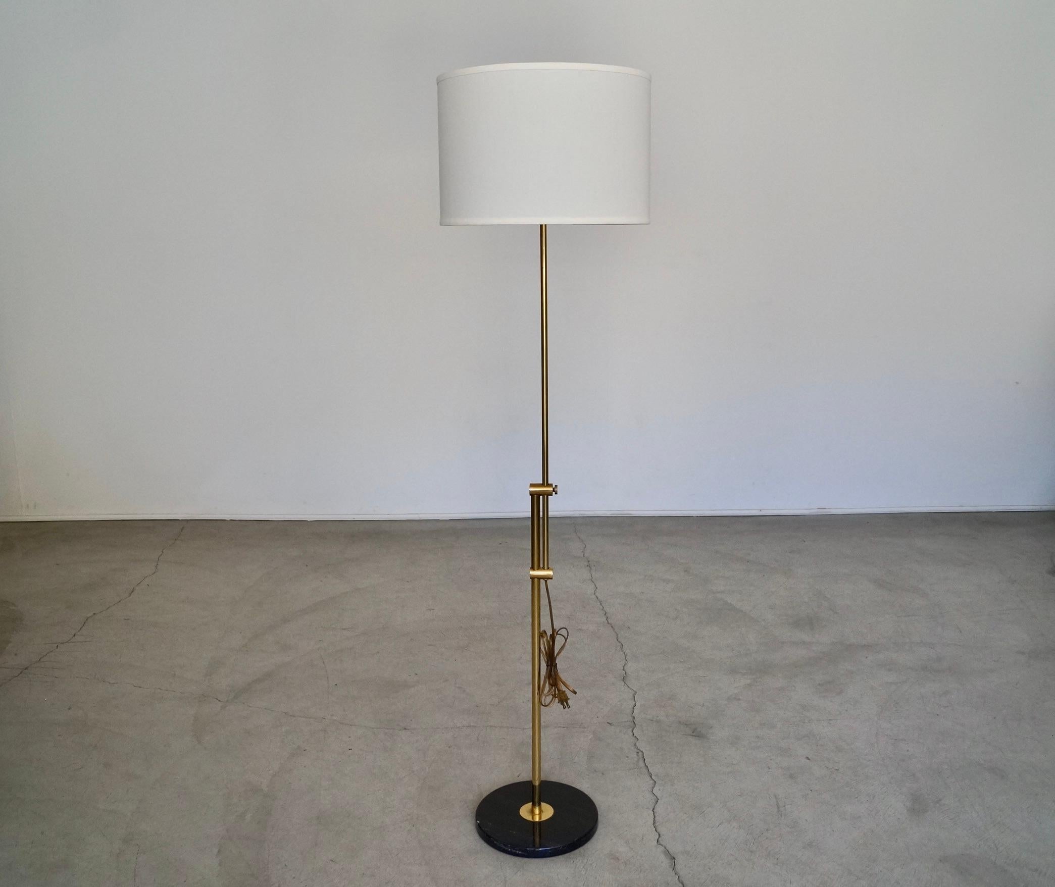 Vintage 1960’s Mid century Modern floor lamp for sale. It’s an incredible lamp with a solid marble base and brass poles and accents. The height is adjustable and the mechanism works smoothly. It’s really solid and well made, and in the manner of