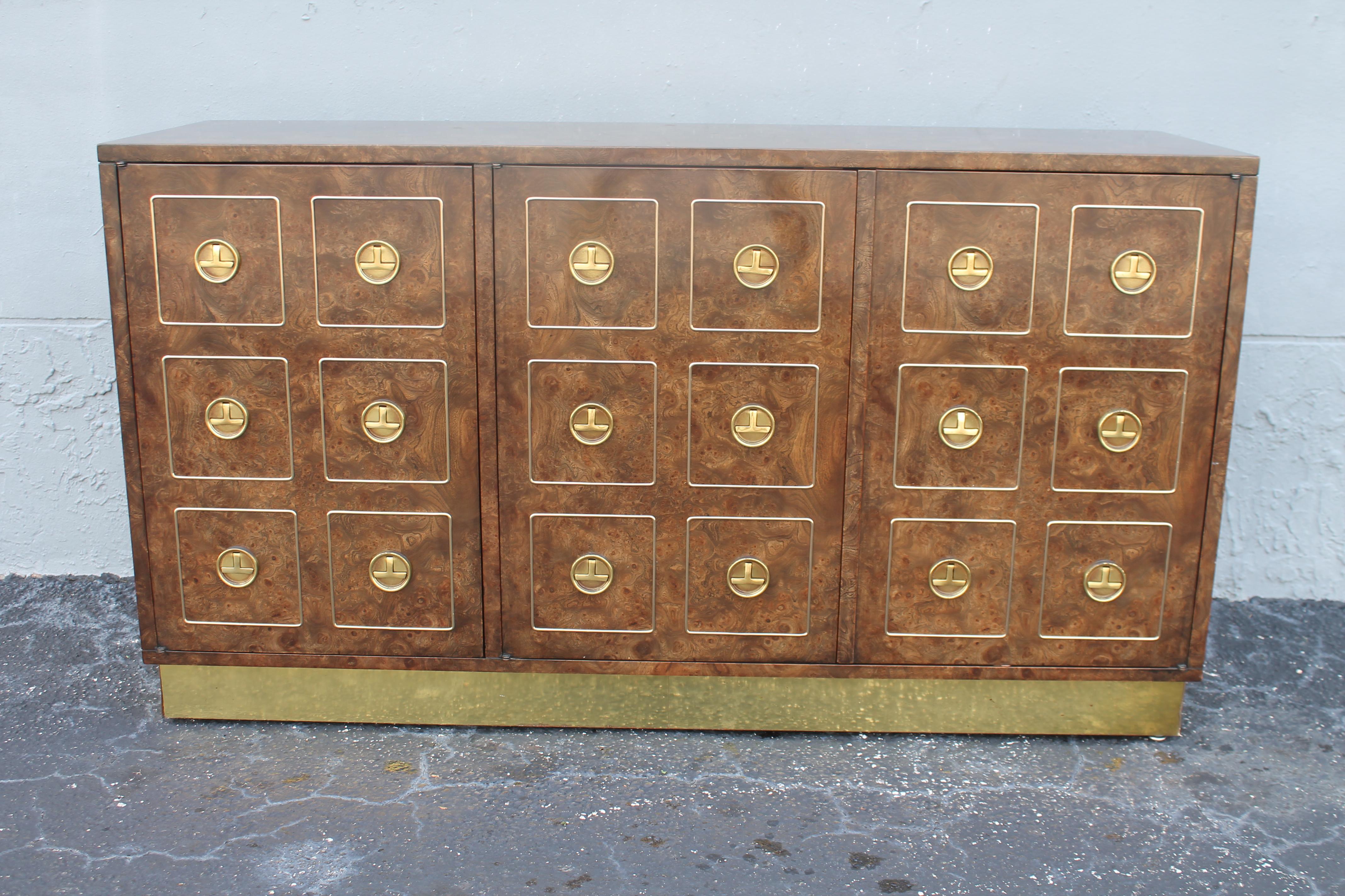 1960's Mid Century Modern Burl Wood Buffet/ Sideboard/ Dry Bar. Beautiful brass  hardware. This buffet is in the style of Mastercraft. Interior shelf, nice storage area. Palm Beach Estate Acquisition.