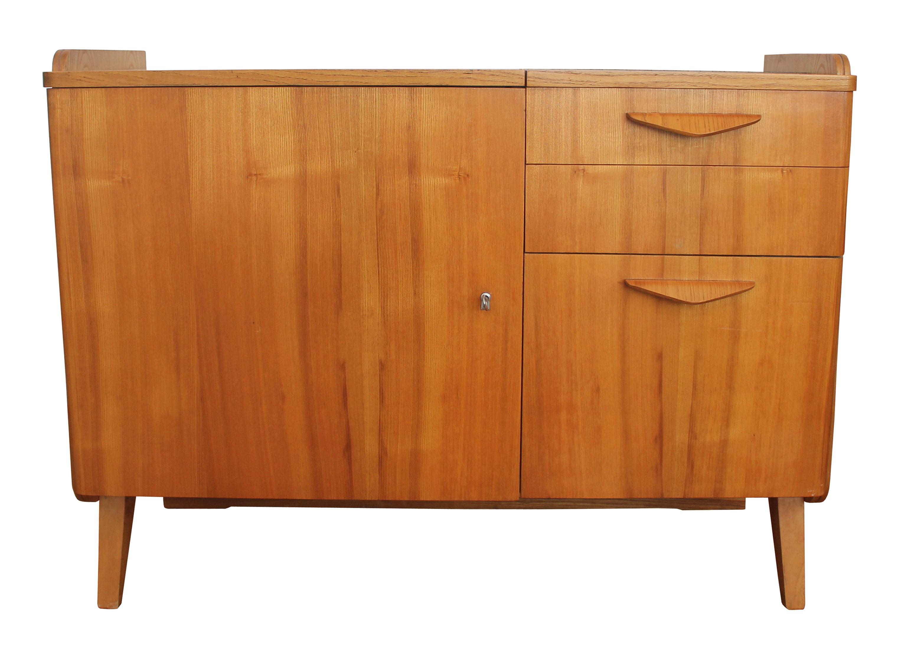 This Mid-Century Modern cabinet was designed by Frantisek Jirak and produced by Tatra Nabytok in 1960’s Czechoslovakia.

The cabinet was inspired by Scandi design and is made of stunning solid Ash wood. The delicate detailing of this piece with