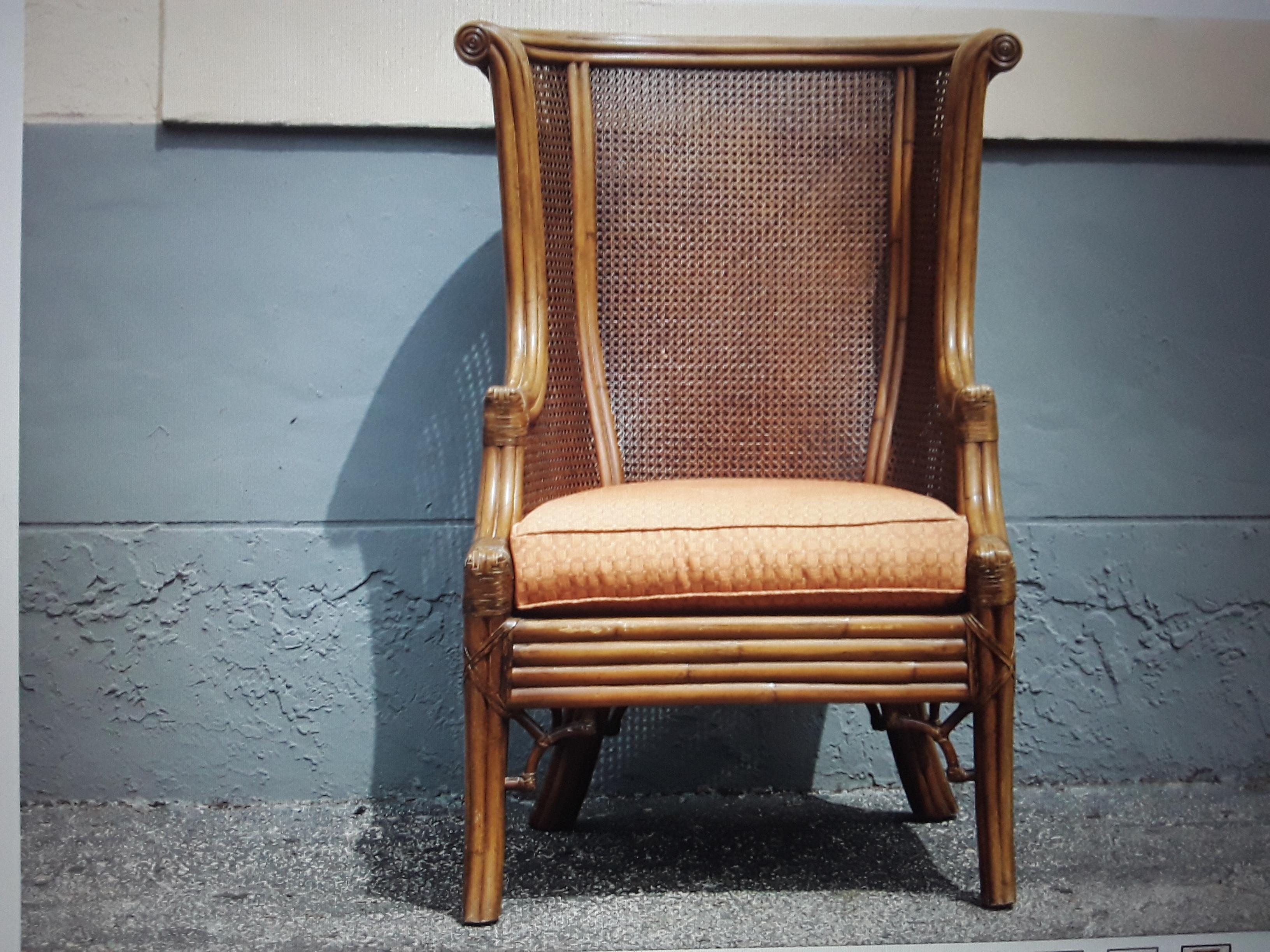 c1960's Mid Century Modern Wingback Chair. Double Caned with Faux Bamboo styled statement Accent Chair. This is a room dominating exceptional chair.
