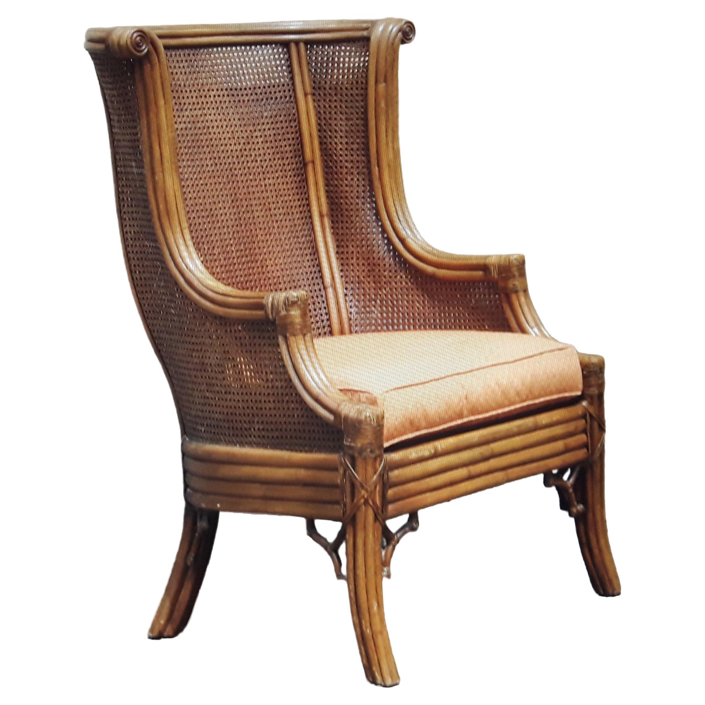 1960's Mid Century Modern Carved Faux Bamboo and Double Caned Wingback Chair For Sale