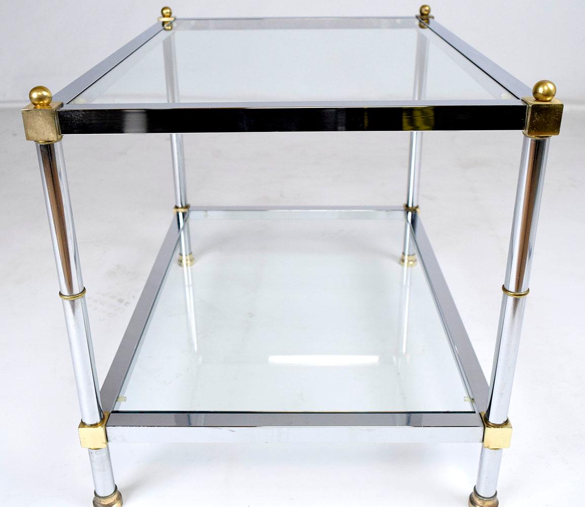 Discover this extraordinary 1960s Mid-Century Modern side table, meticulously handcrafted from steel and brass and newly cleaned and polished by our expert craftsman team. This sleek end table features a rectangular frame finished in chrome,