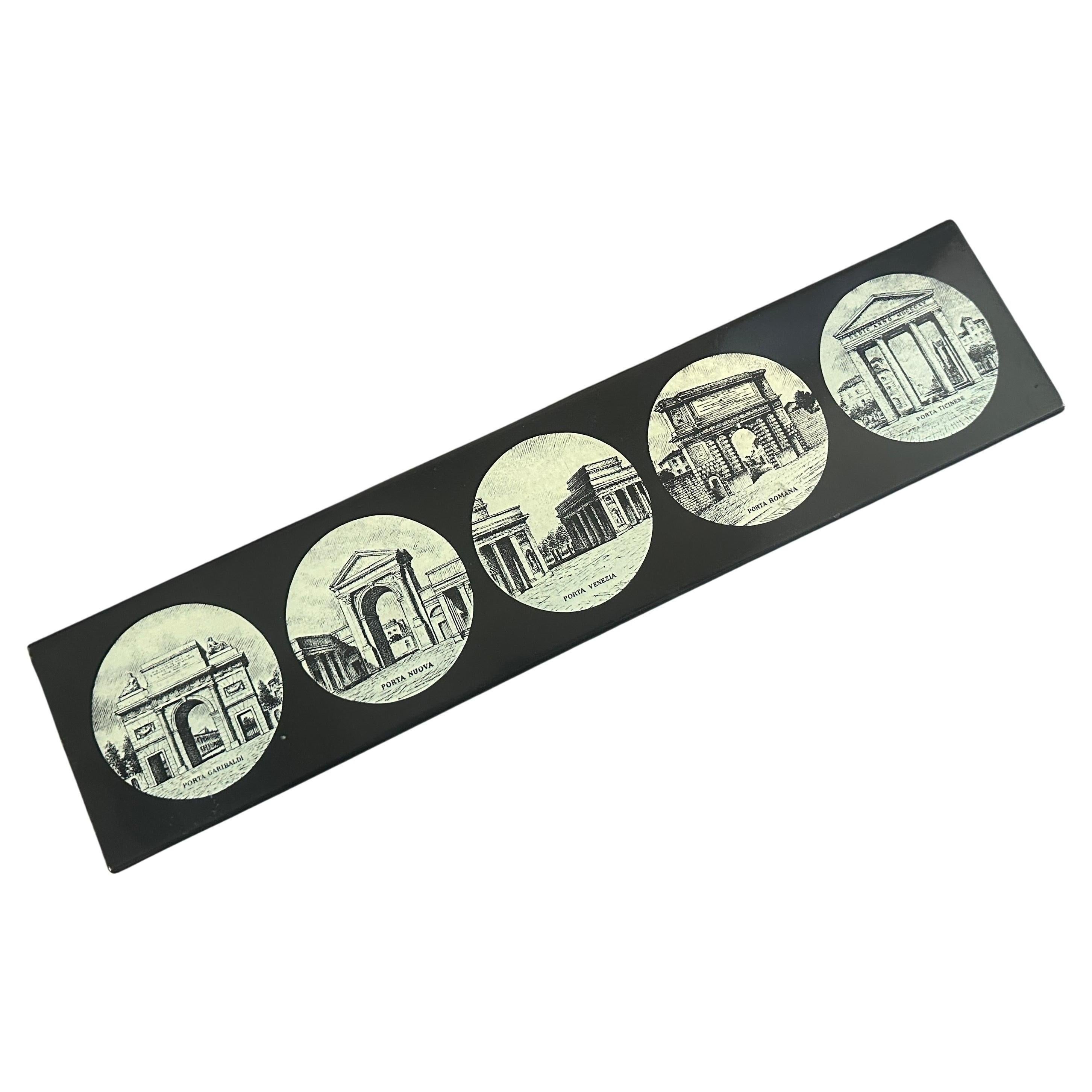 A beautiful and rare mid-century modern cigarette box designed by the renowned Italian artist, Piero Fornasetti (1913-1988), in the 1960s. This piece is part of the iconic 
