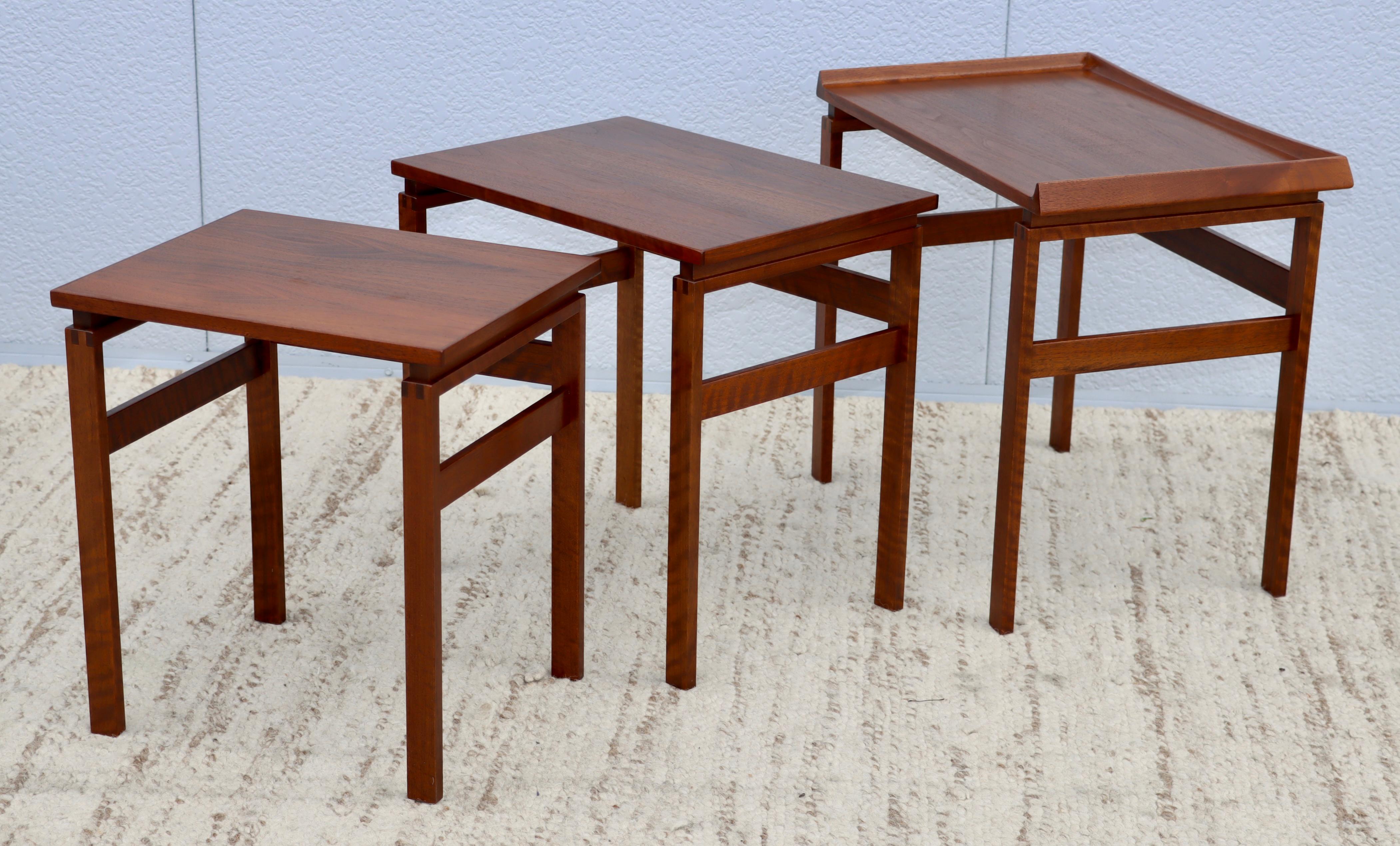 1960s Mid-Century Modern teak and walnut nesting table by Moreddi, lightly restored with minor wear and patina due to age and use.