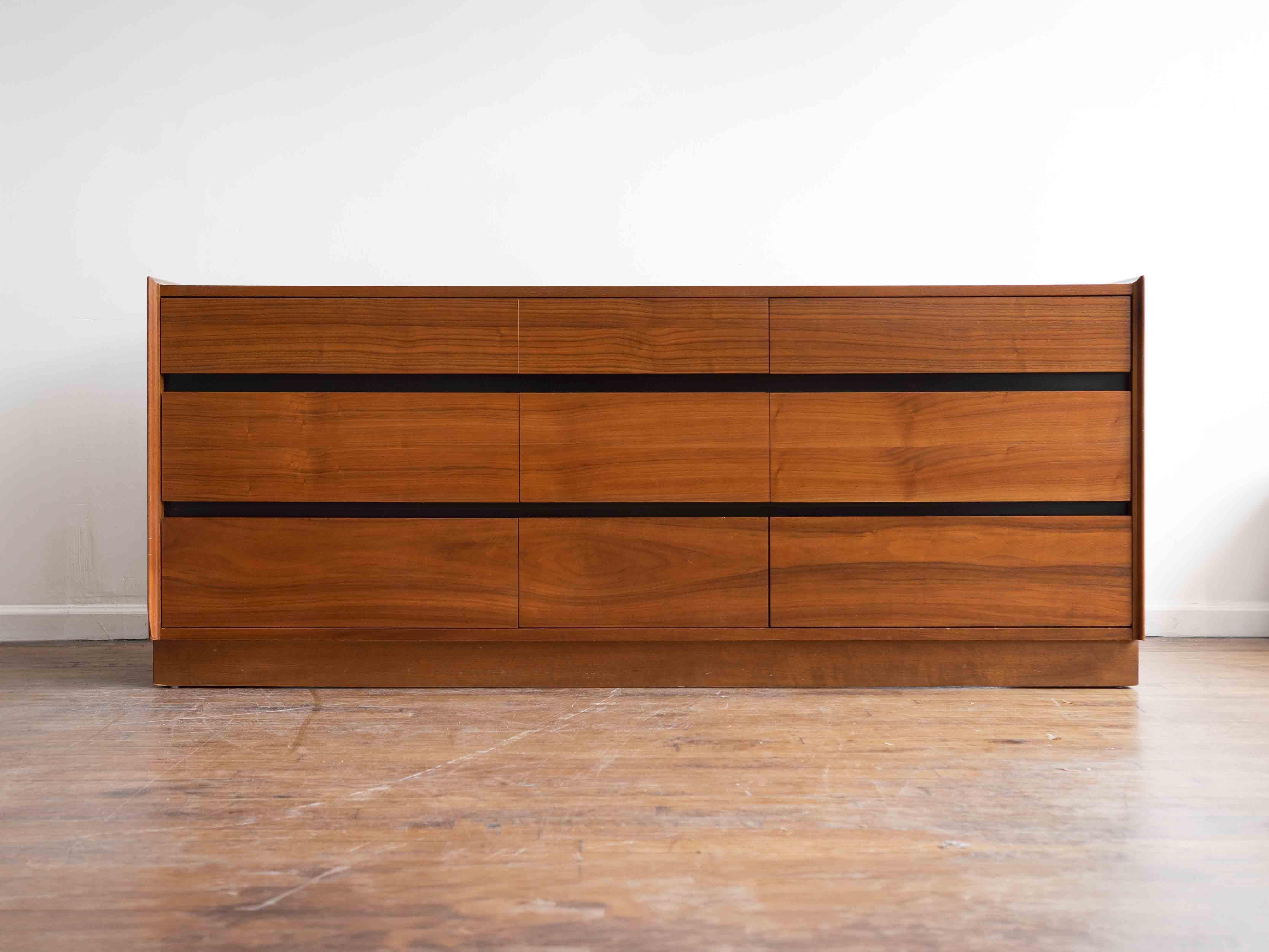 Please inquire for shipping rates. 

72” x 19” x 30”H

Classing 9 drawer lowboy designed by Merton Gershun for Dillingham's Esprit line. Walnut body and drawers with figured grain running continuously across the drawer fronts; black lacquered