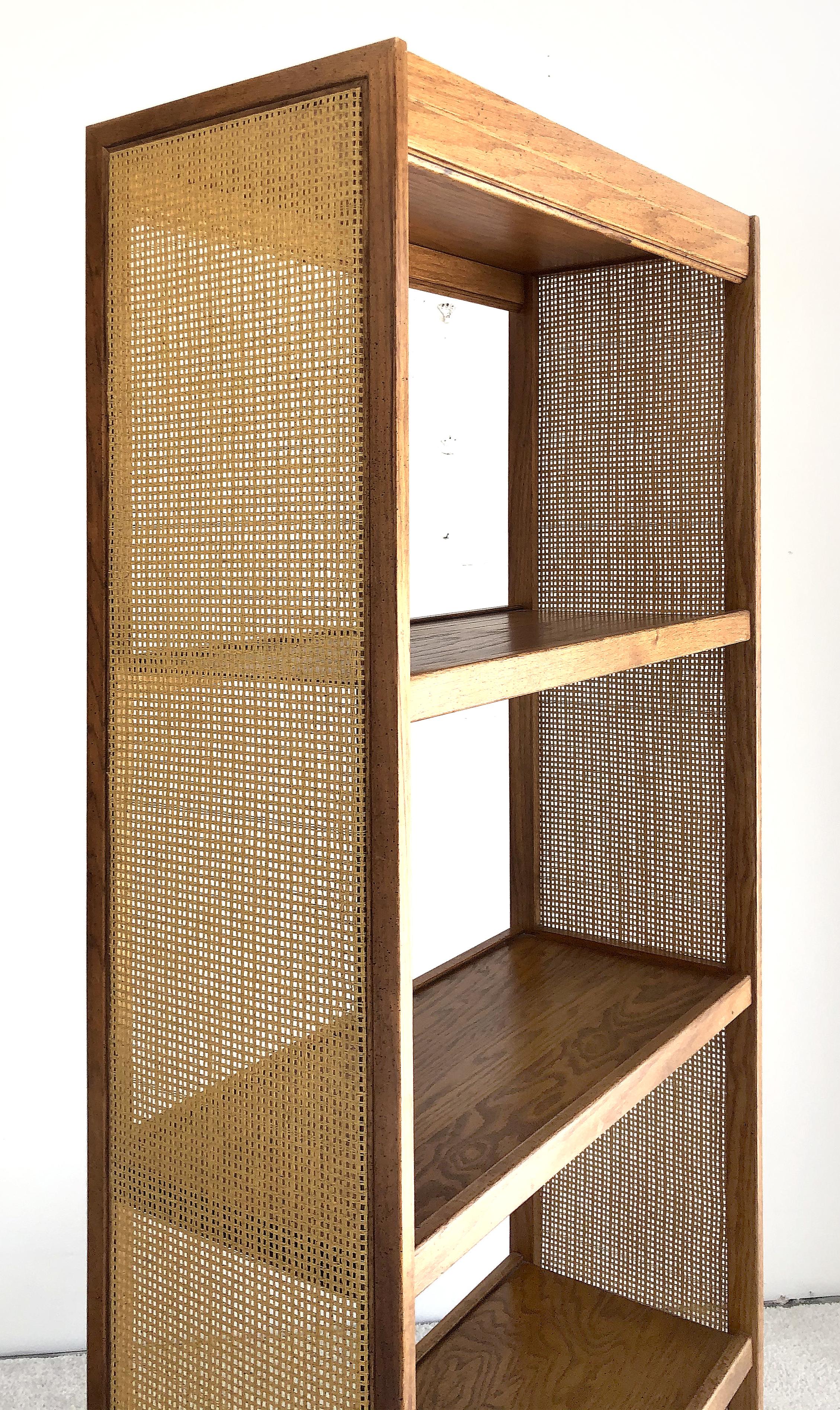 1960s Mid-Century Modern Dunbar style bookshelf

It is a sleek midcentury designed 4-shelf wooden bookcase with inset woven cane panels. The bookcase is created in the style of Dunbar Furniture.
 
 
 
   