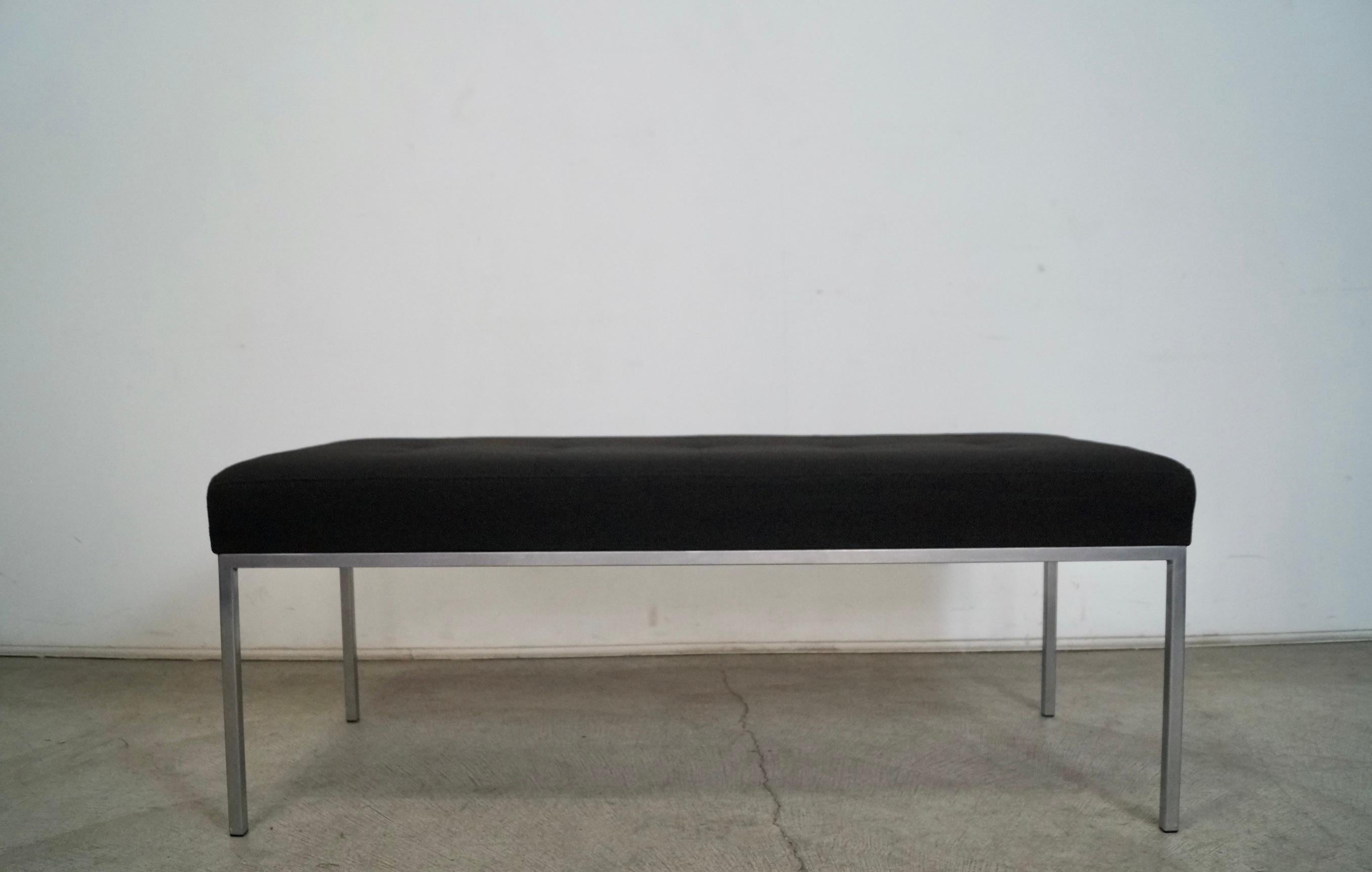 Vintage original Midcentury Modern bench for sale. Knoll style with an aluminum frame and reupholstered in new Knoll style black tweed and foam. It's stitch tufted and very elegant. Beautiful accent bench that would look great in a home or office.