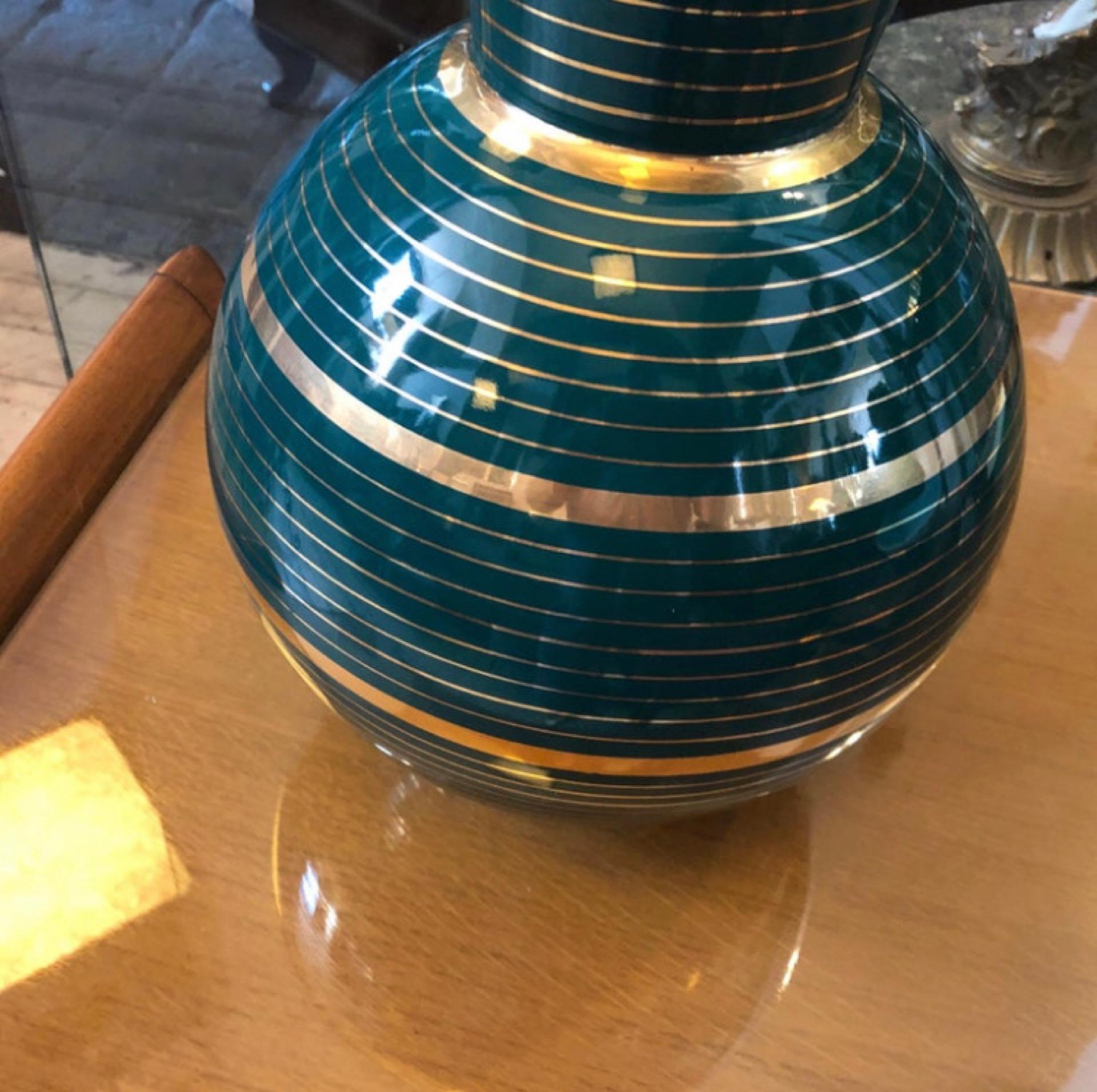 Stylish green and gold ceramic vase designed and manufactured in Sesto Fiorentino small town in Tuscany, world famous for hand painted ceramics. It's signed A.A.C.A. on the bottom.